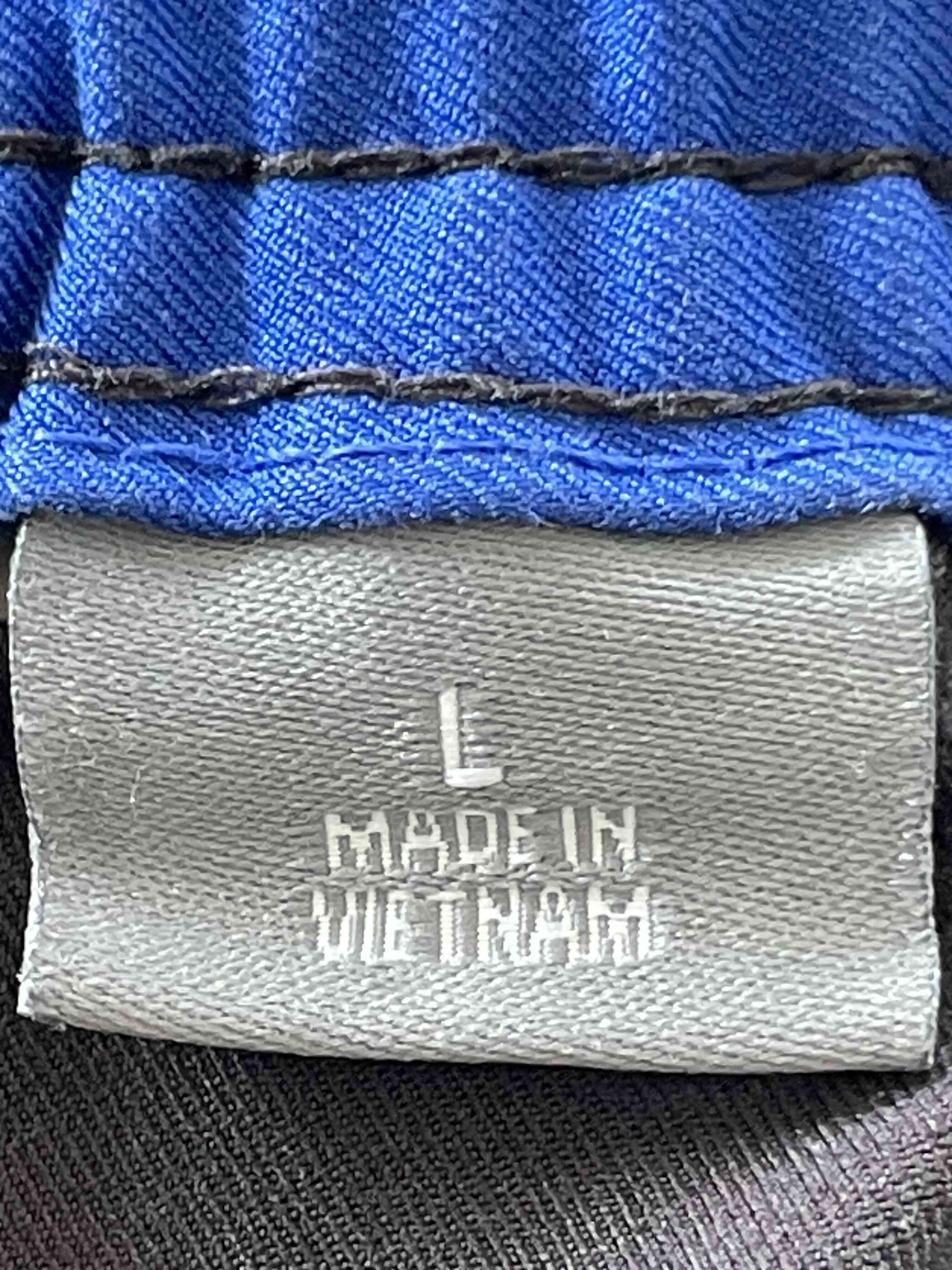 Pantalones deportivos negros con línea azul - miniatura 2