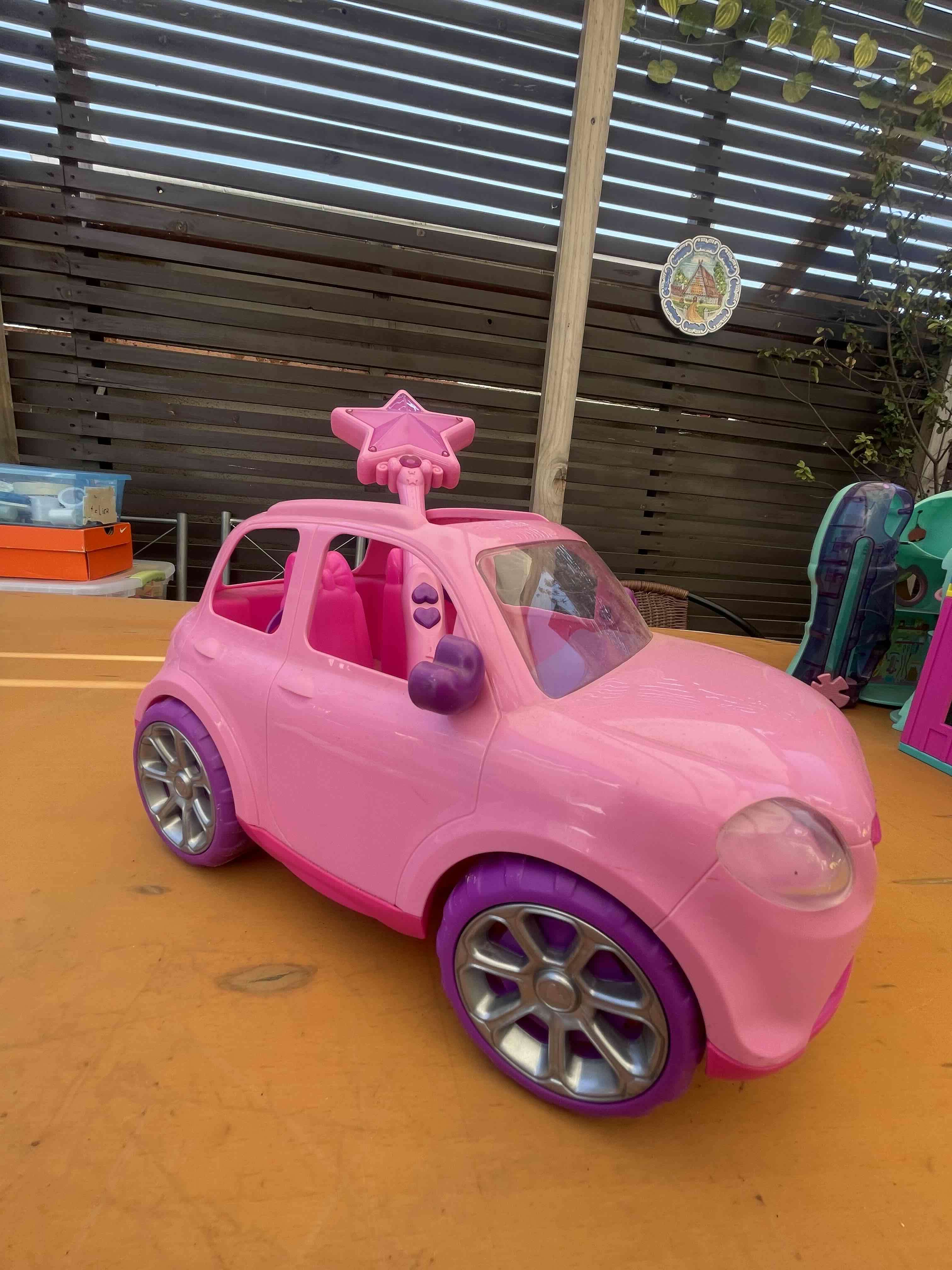 Auto de juguete rosa con varita a control remoto. - miniatura 2