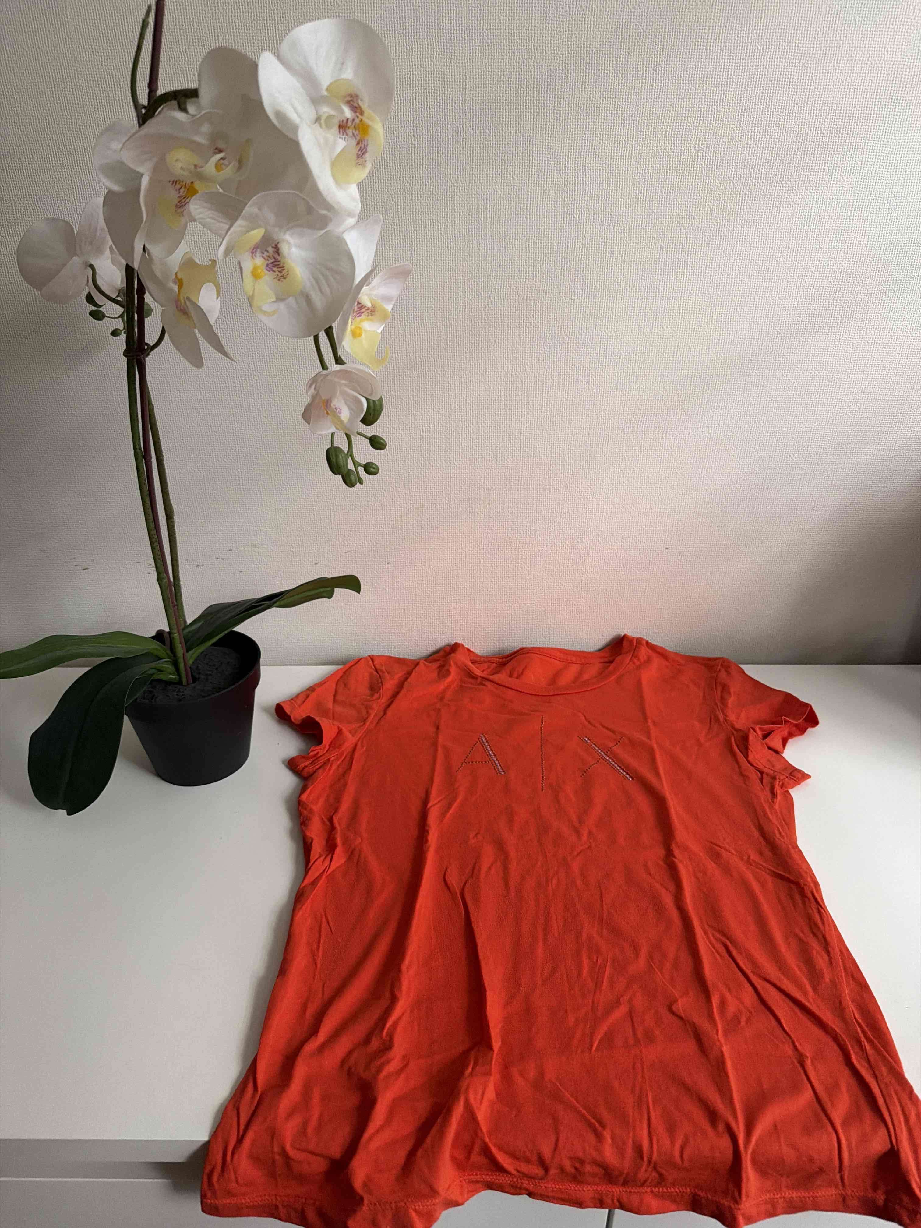 Polera Naranja con diseño AX