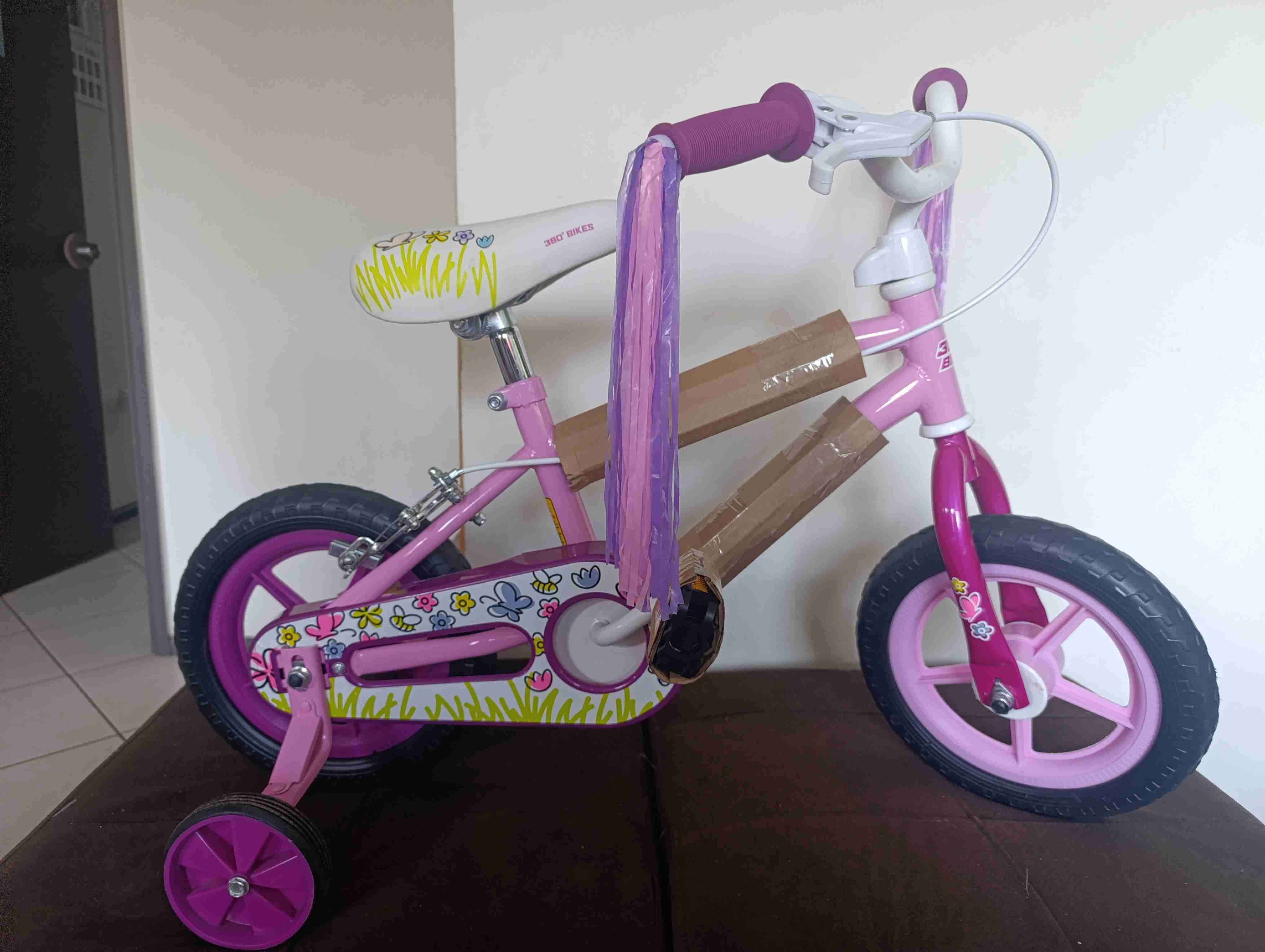 Bicicleta infantil rosa con rueditas aro 12