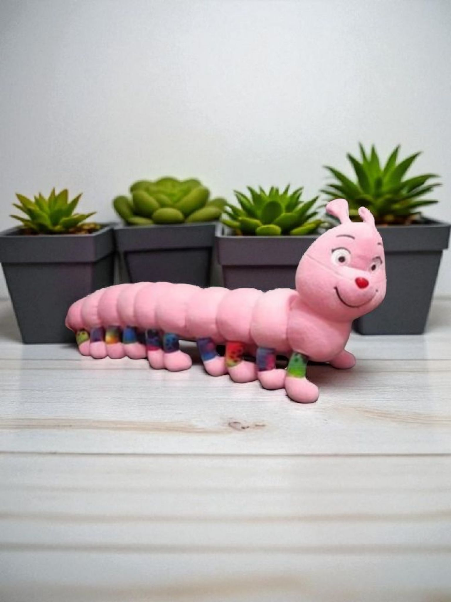 Juguete oruga de peluche