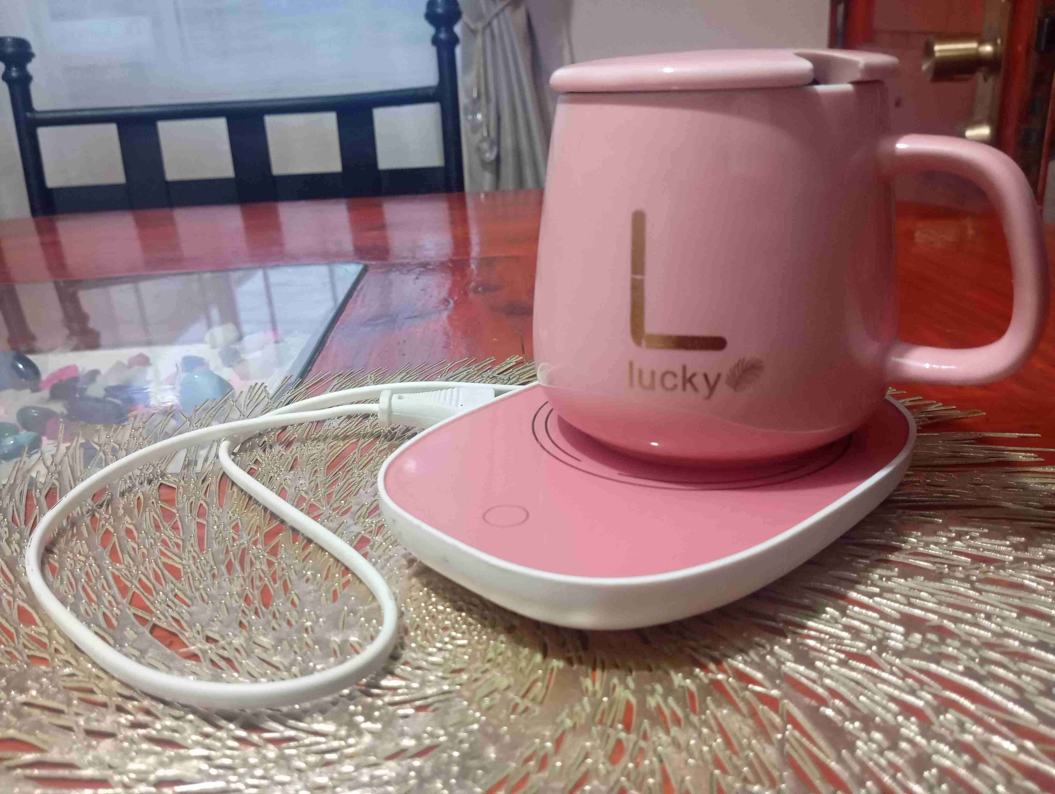 Taza rosada con calentador
