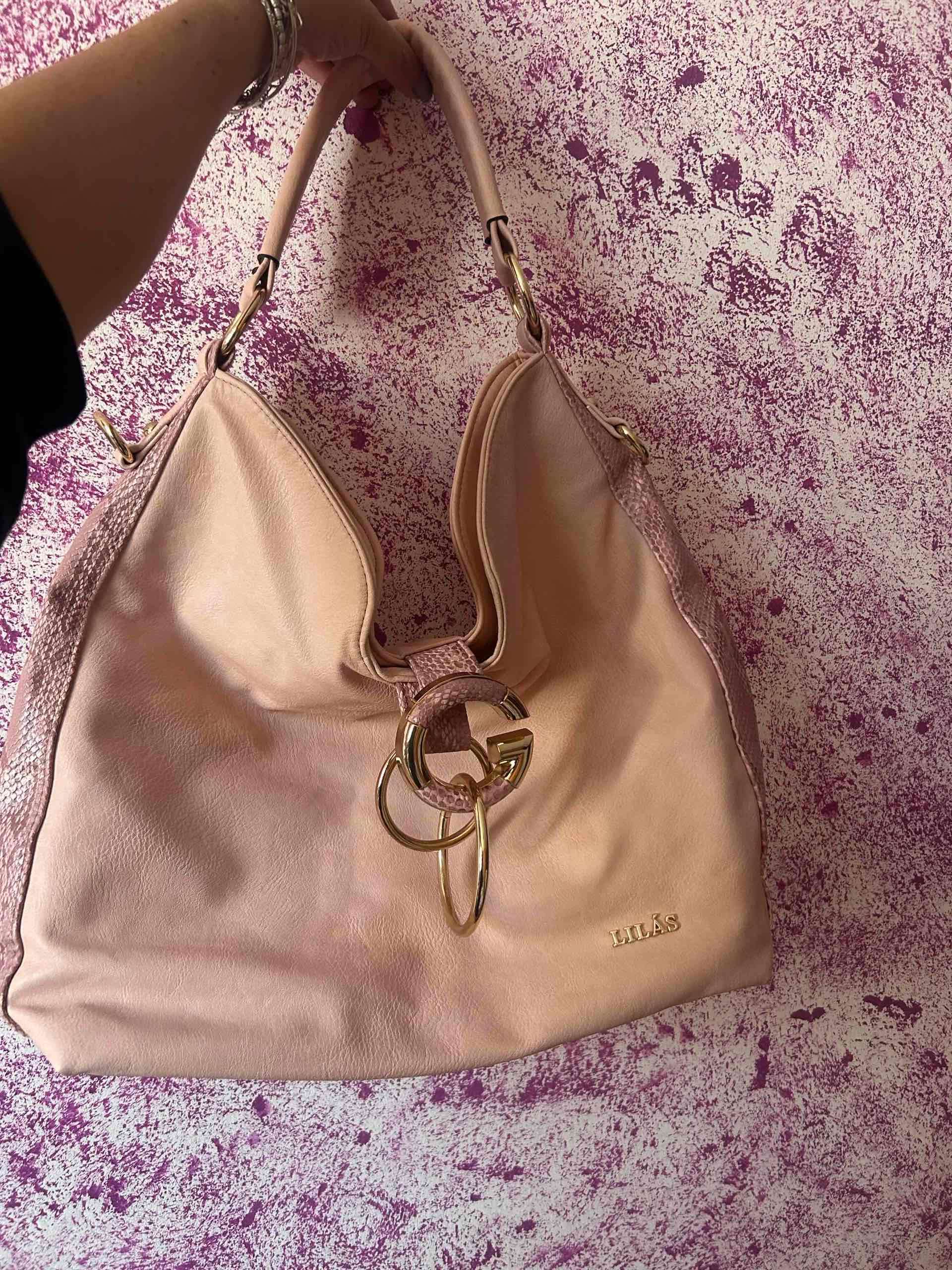 Bolso Lilás rosa claro con aro dorado