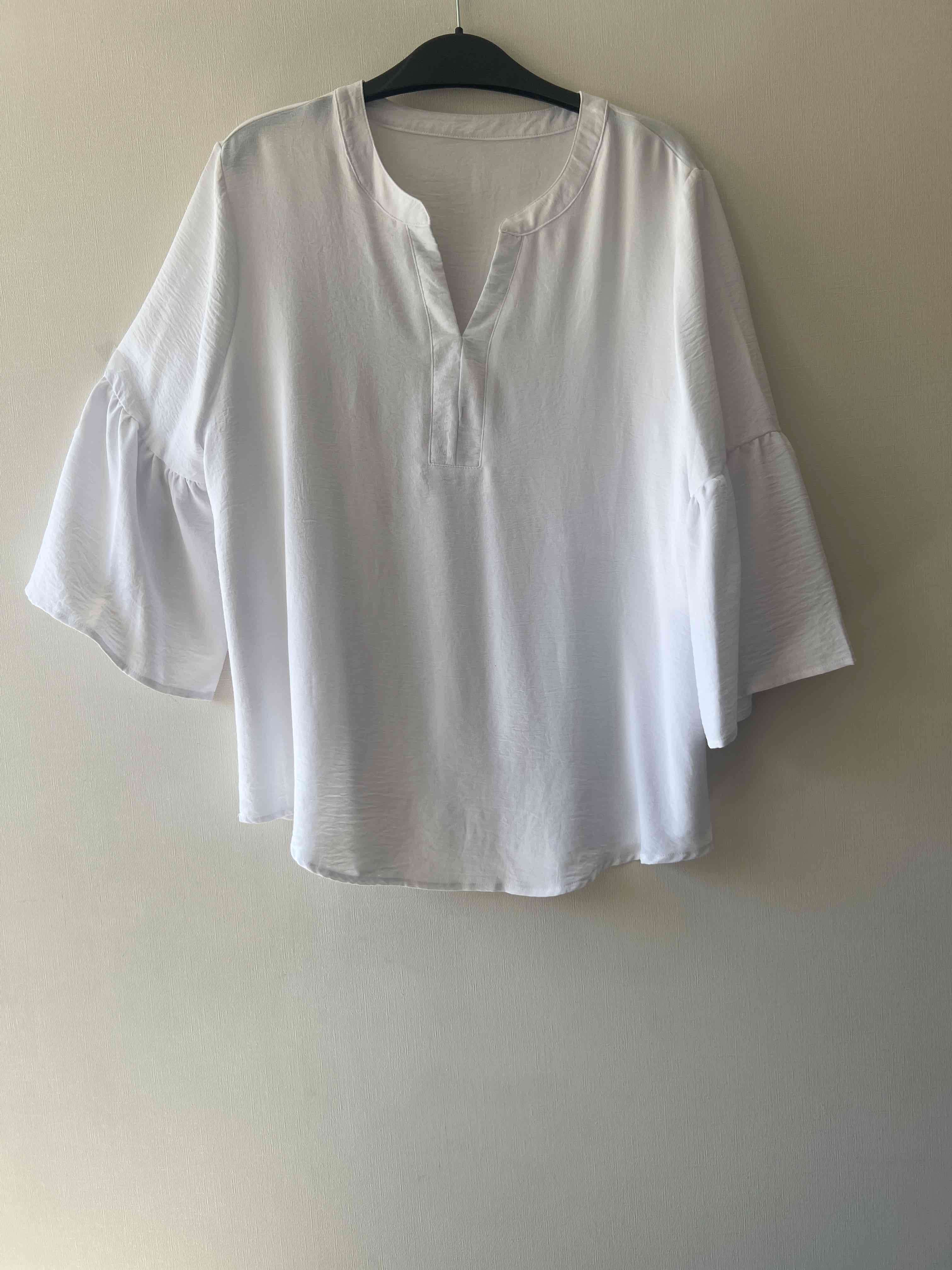 Blusa blanca de manga ancha