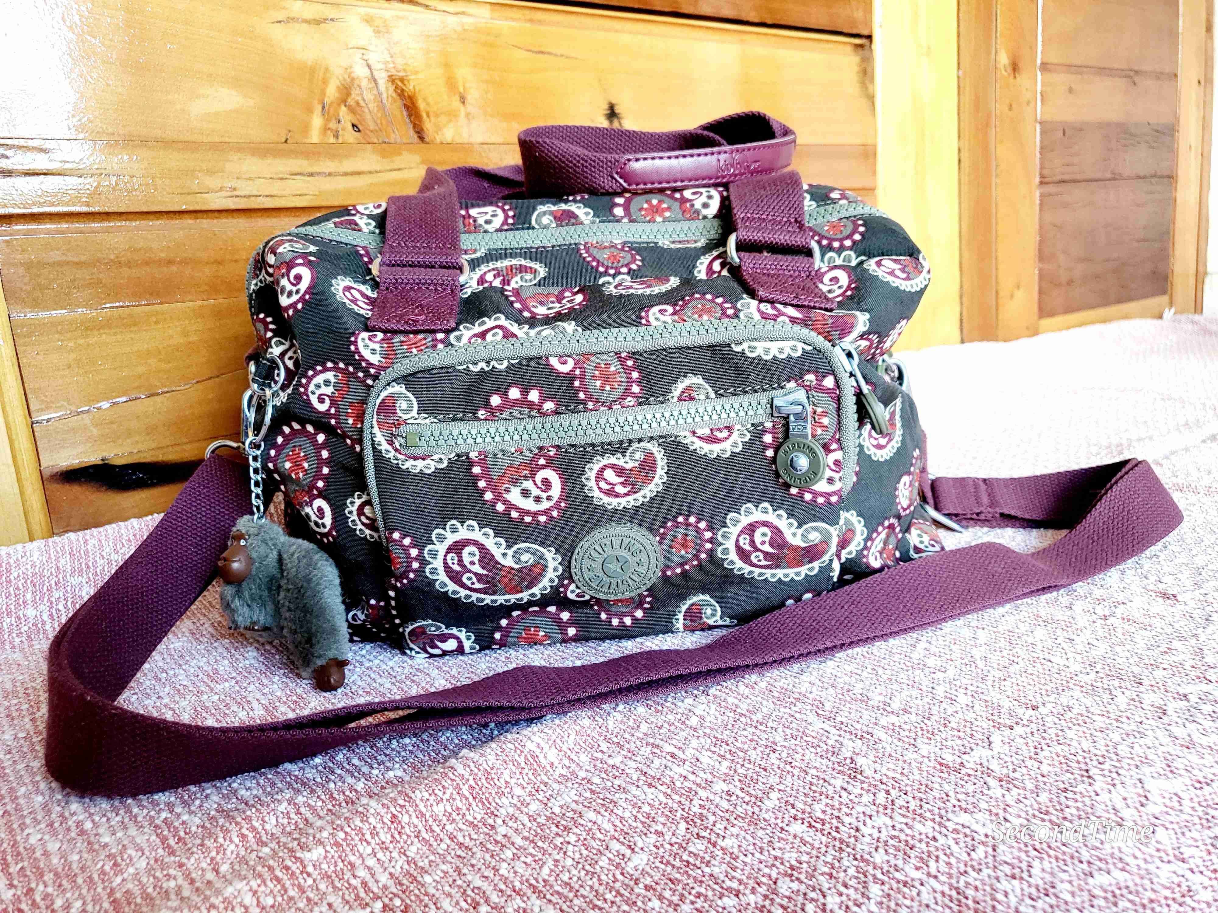 Bolso Kipling estampado marrón y burdeos
