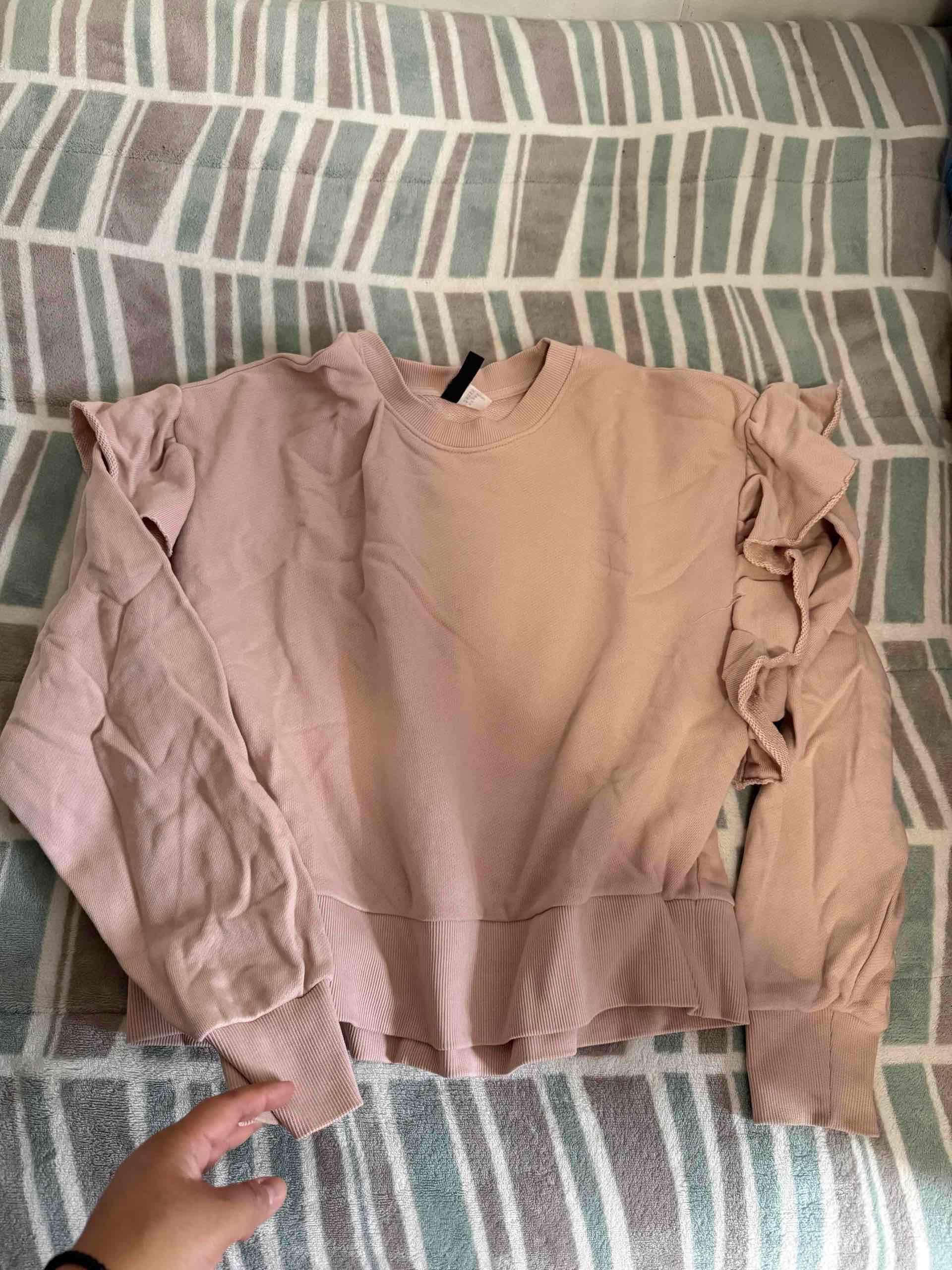 Polerón rosado con olanes