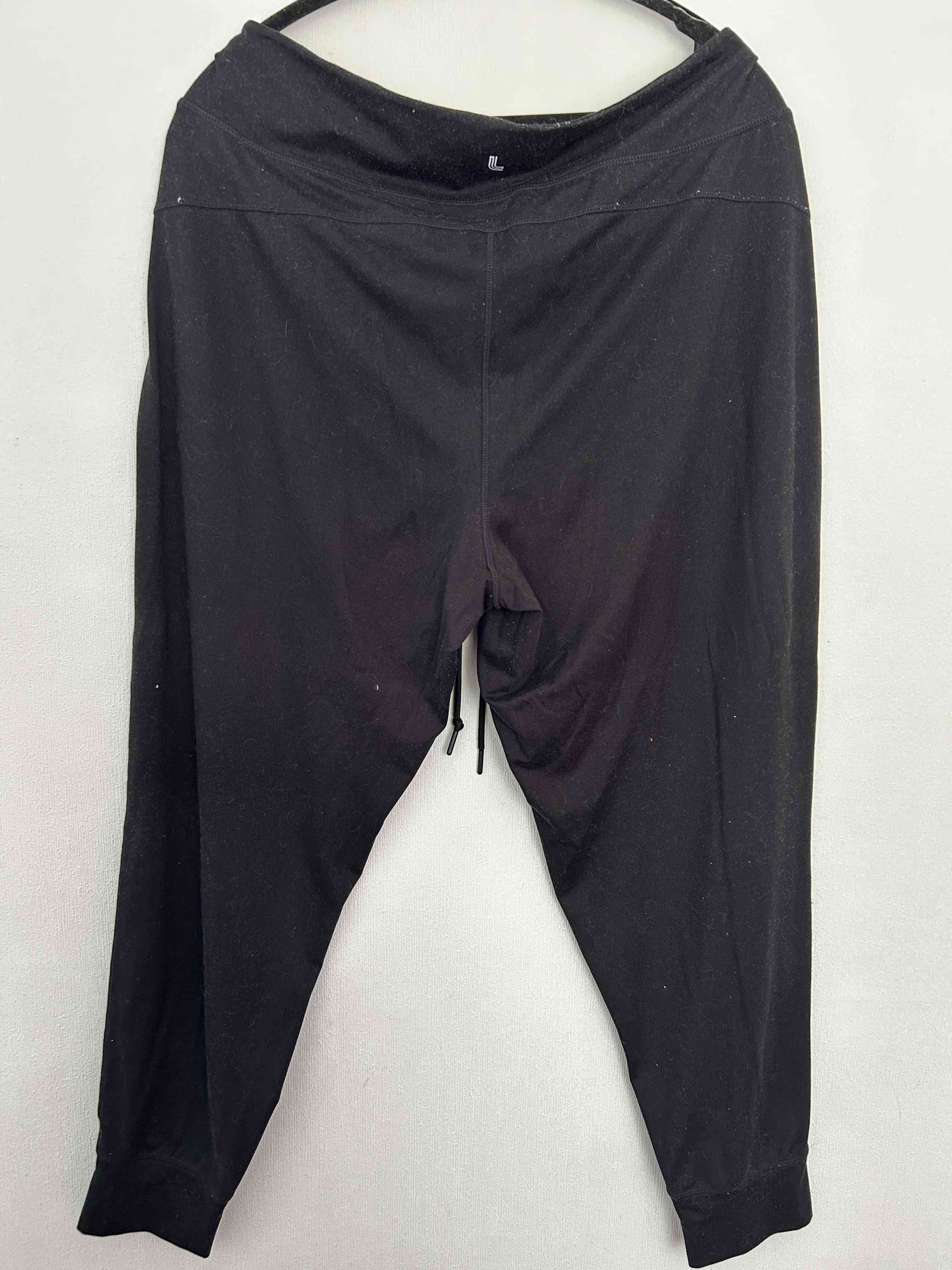 Pantalon buzo negro y gris - miniatura 2