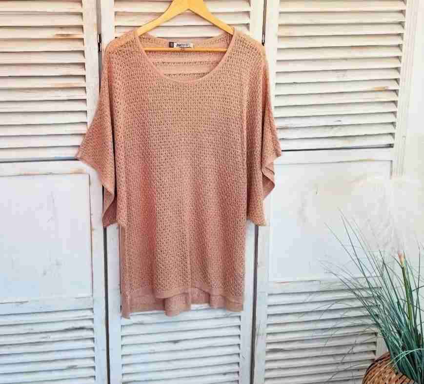 Poncho tejido color rosa