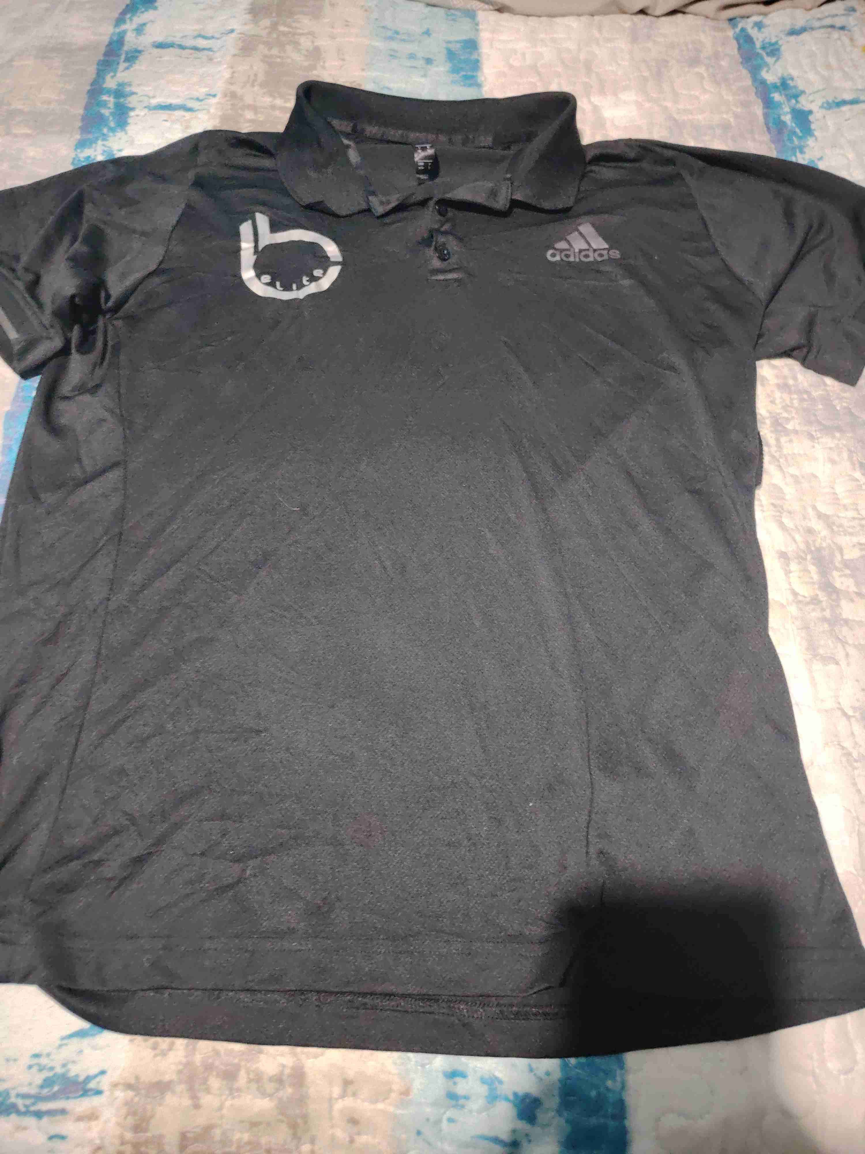 Polera polo negra Adidas