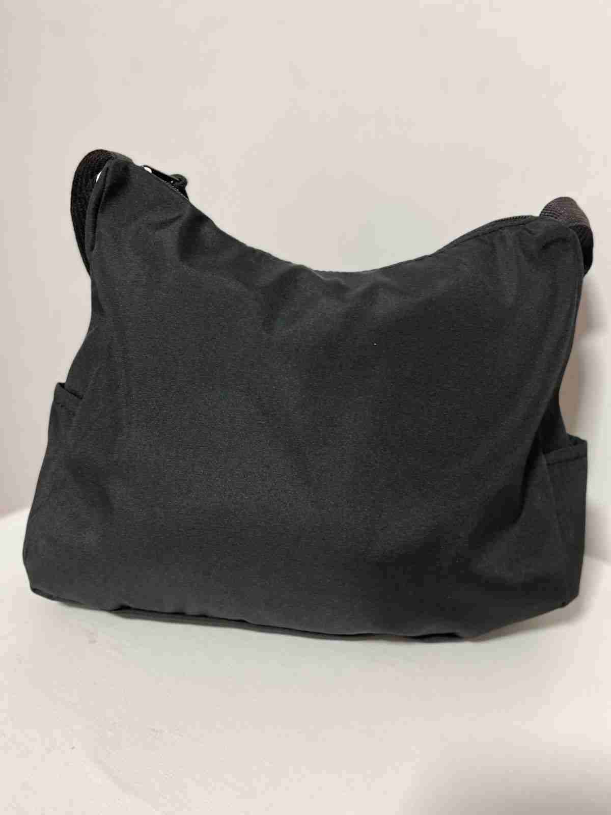 Cartera negra con correas trenzadas - miniatura 2