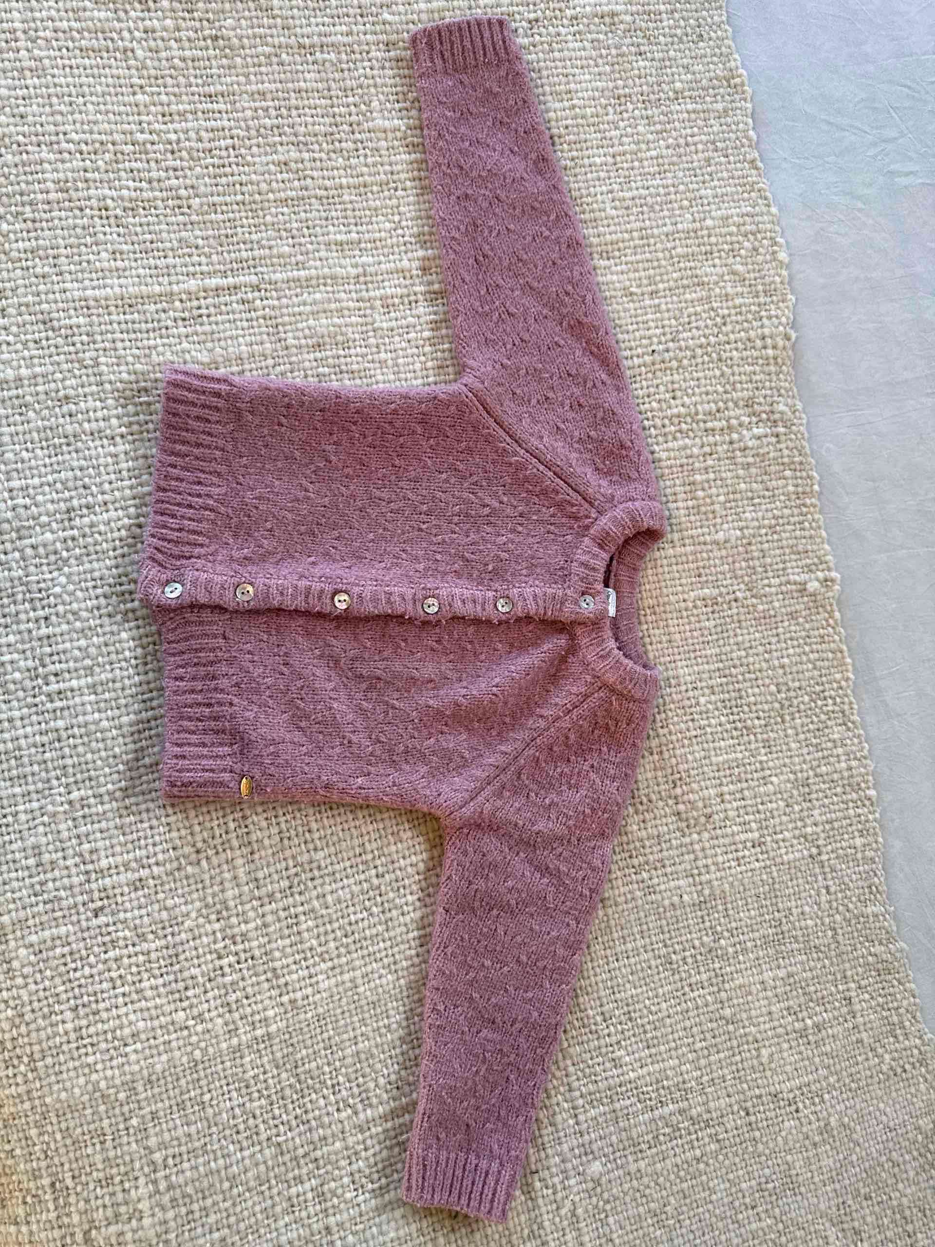 Chaleco rosa de lana para niña