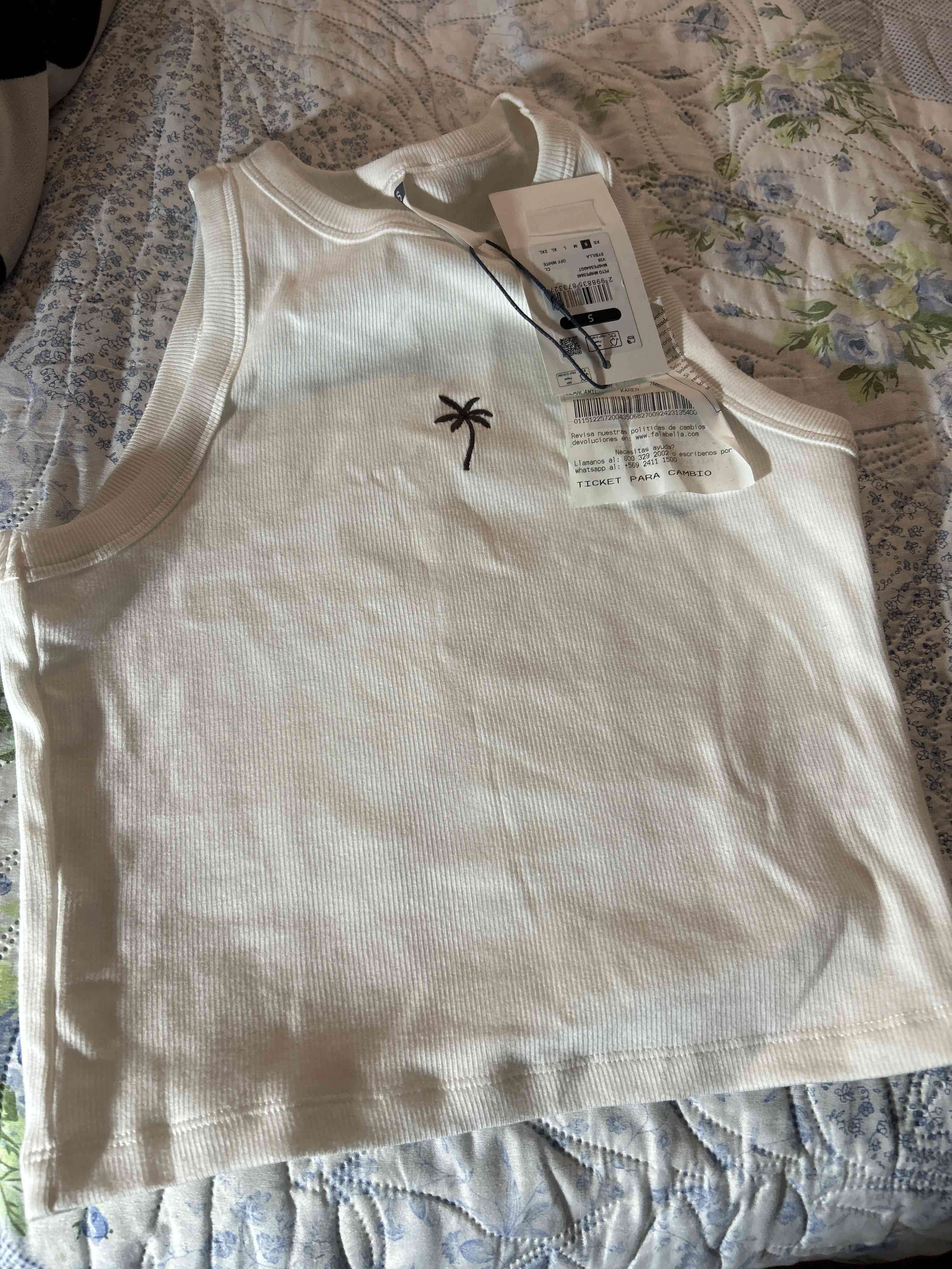 Polera sin mangas blanca con palma