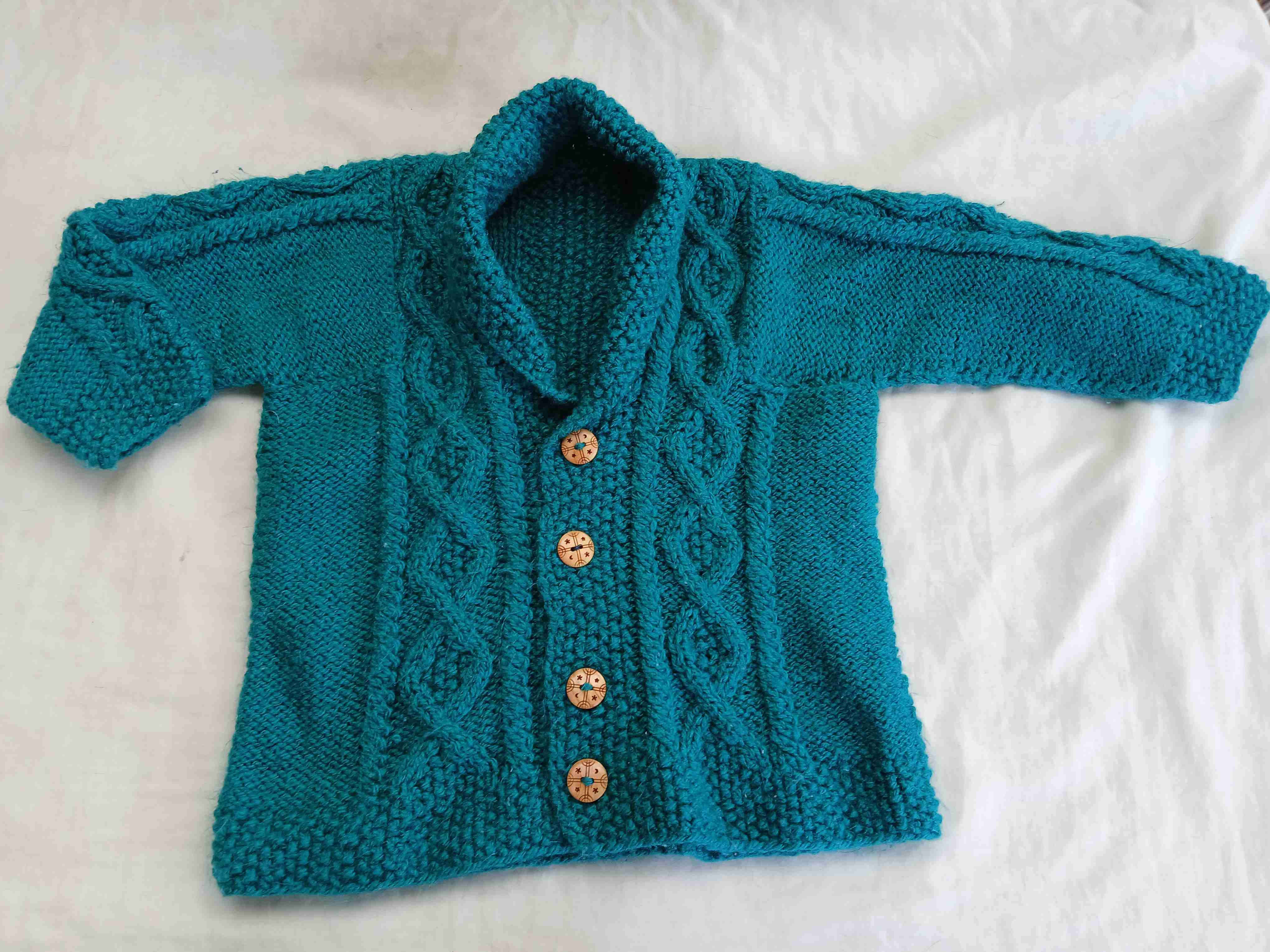 Chaleco tejido verde turqueza para niño