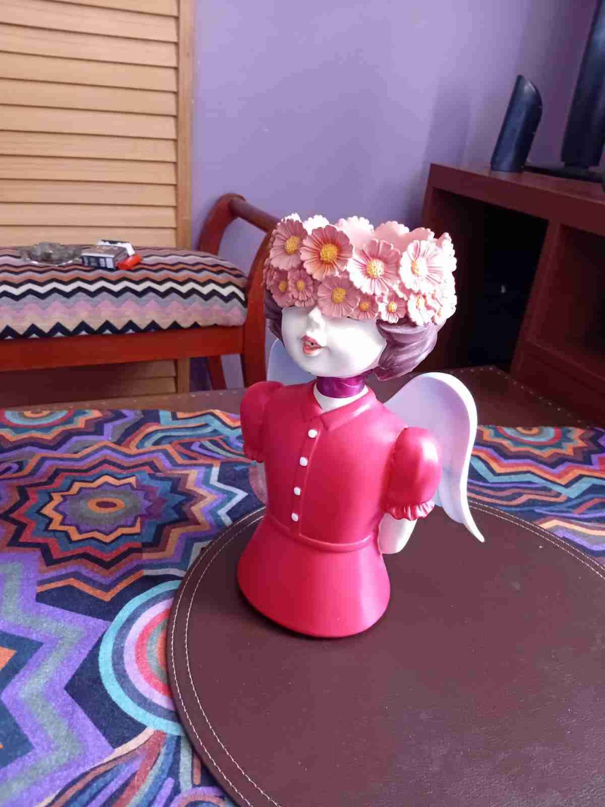Figura de decoración con flores