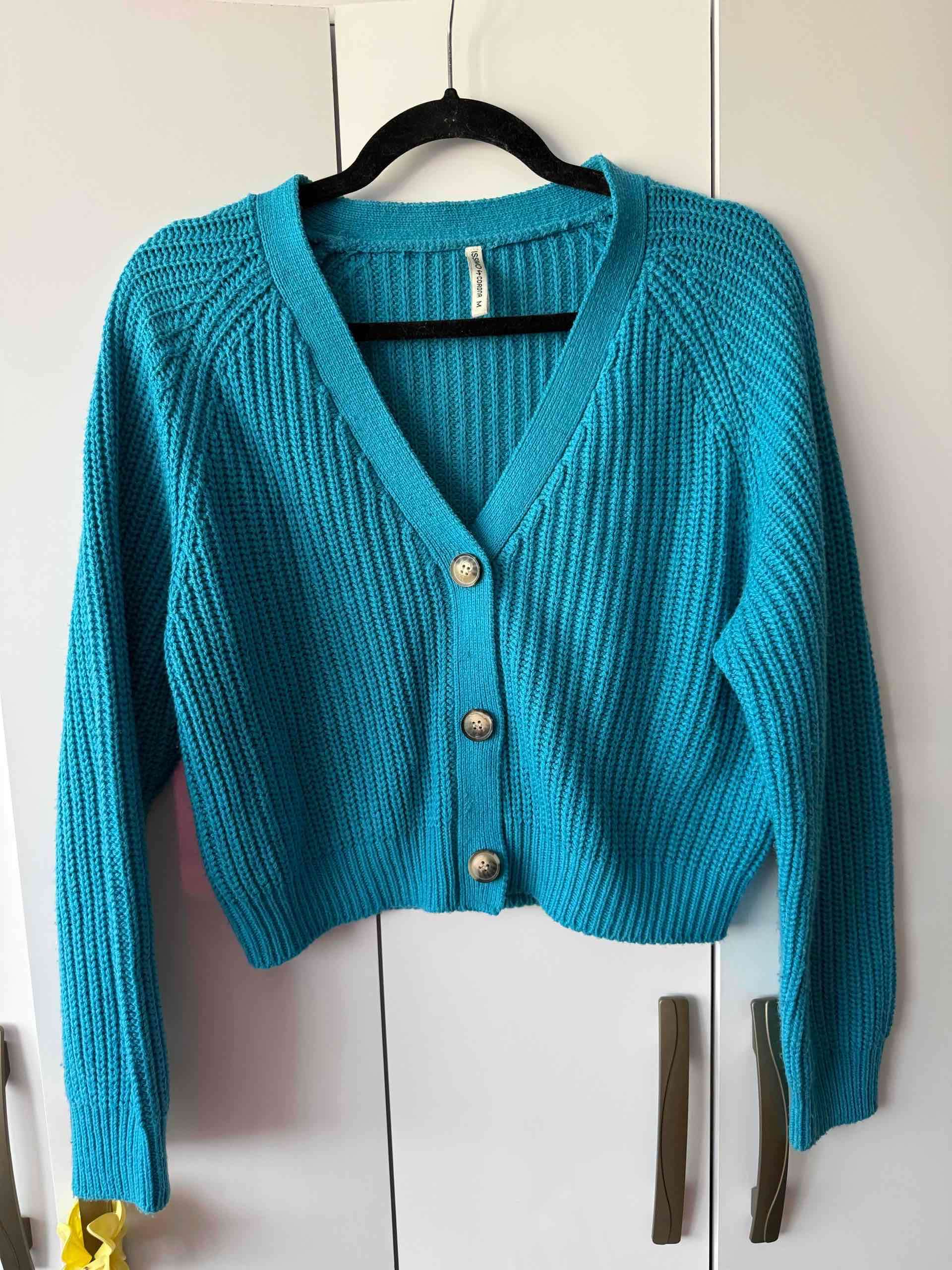 Chaleco turquesa con botones