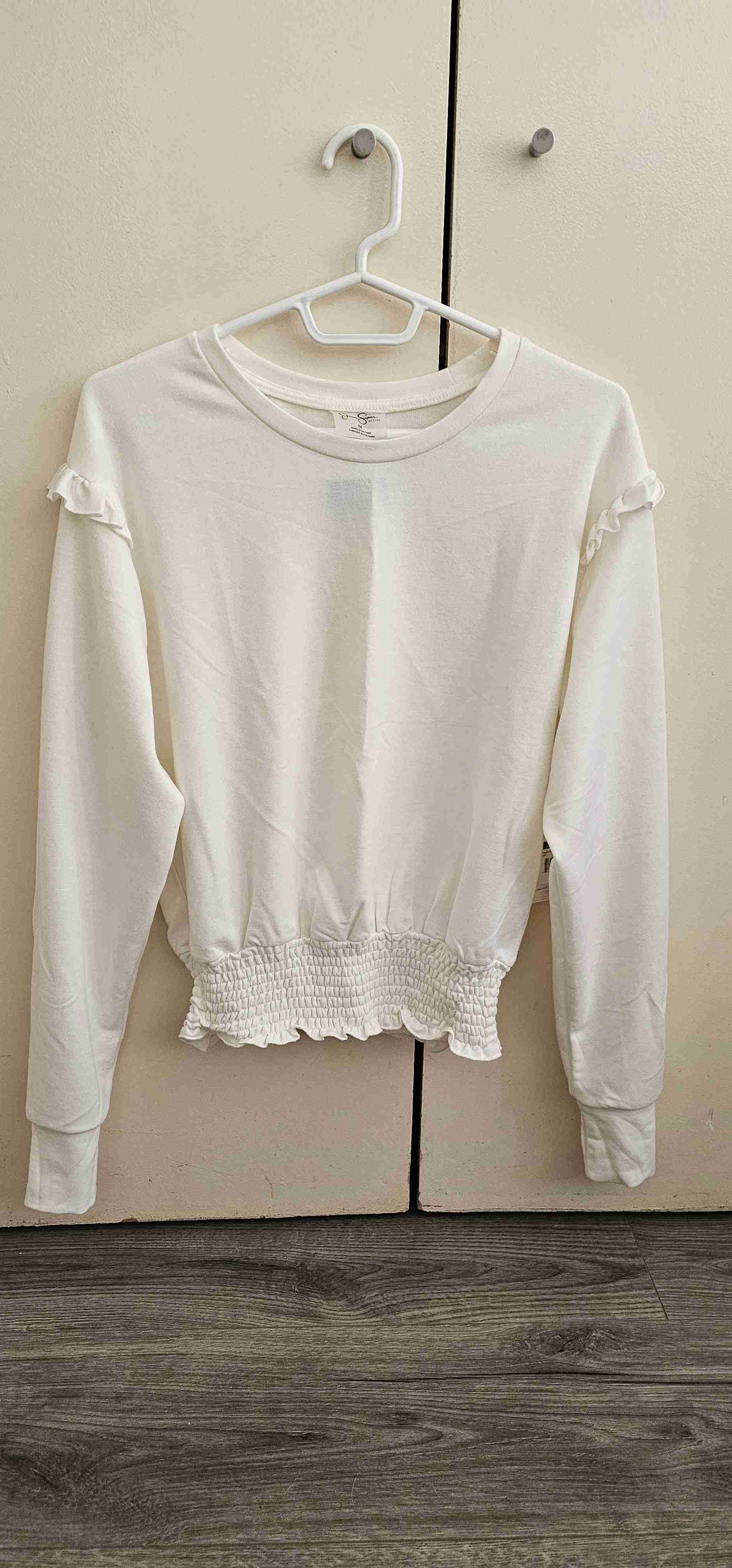 Polerón blanco con volantes