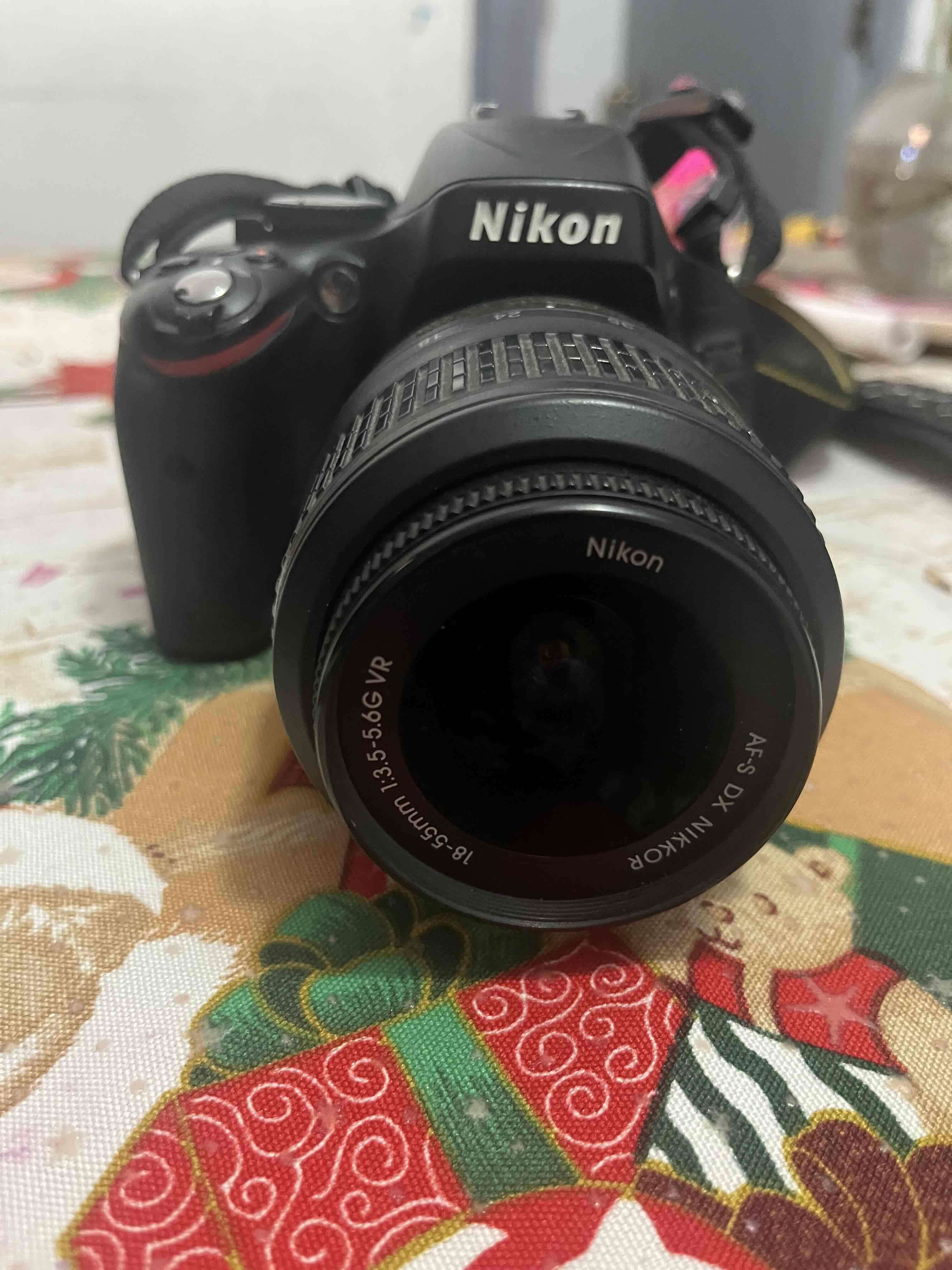 Cámara Nikon con lente zoom - miniatura 4