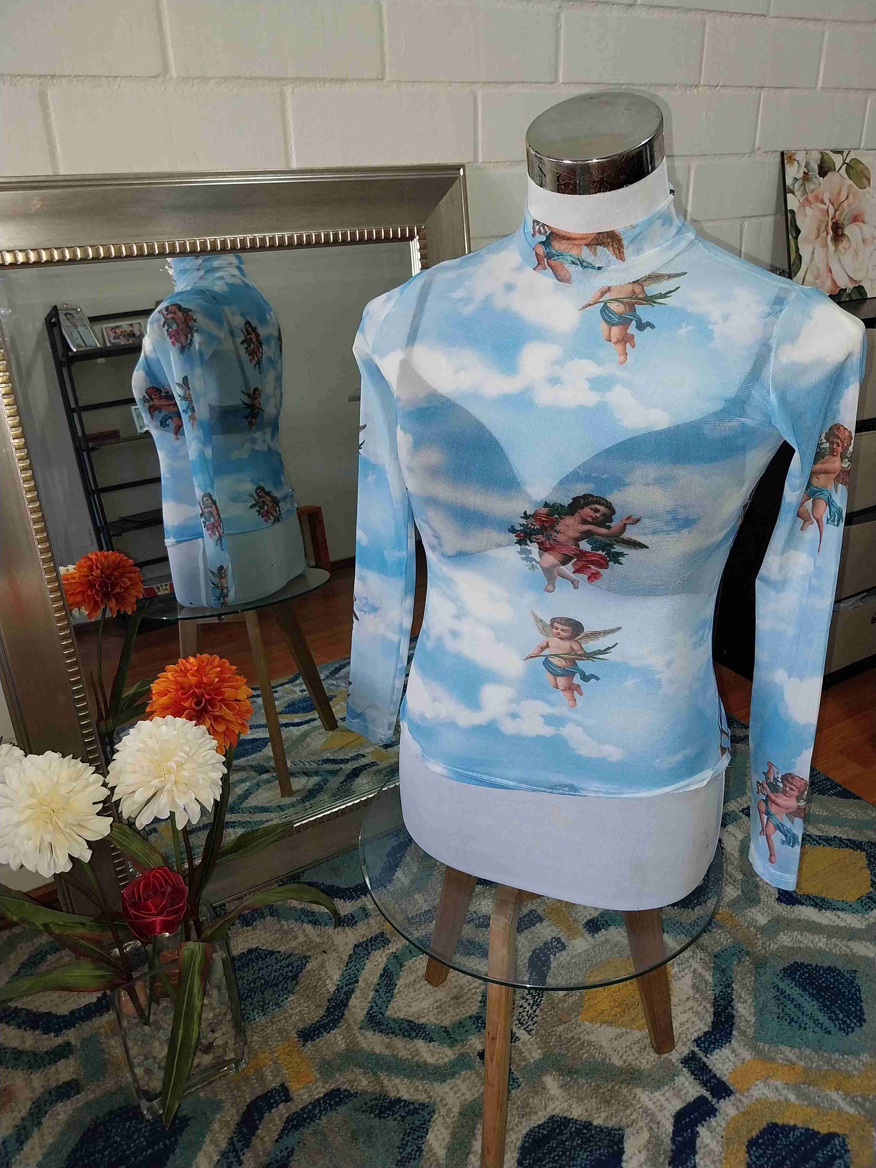 Polera estampada de ángeles,toda la ropa $3000 cad - 1