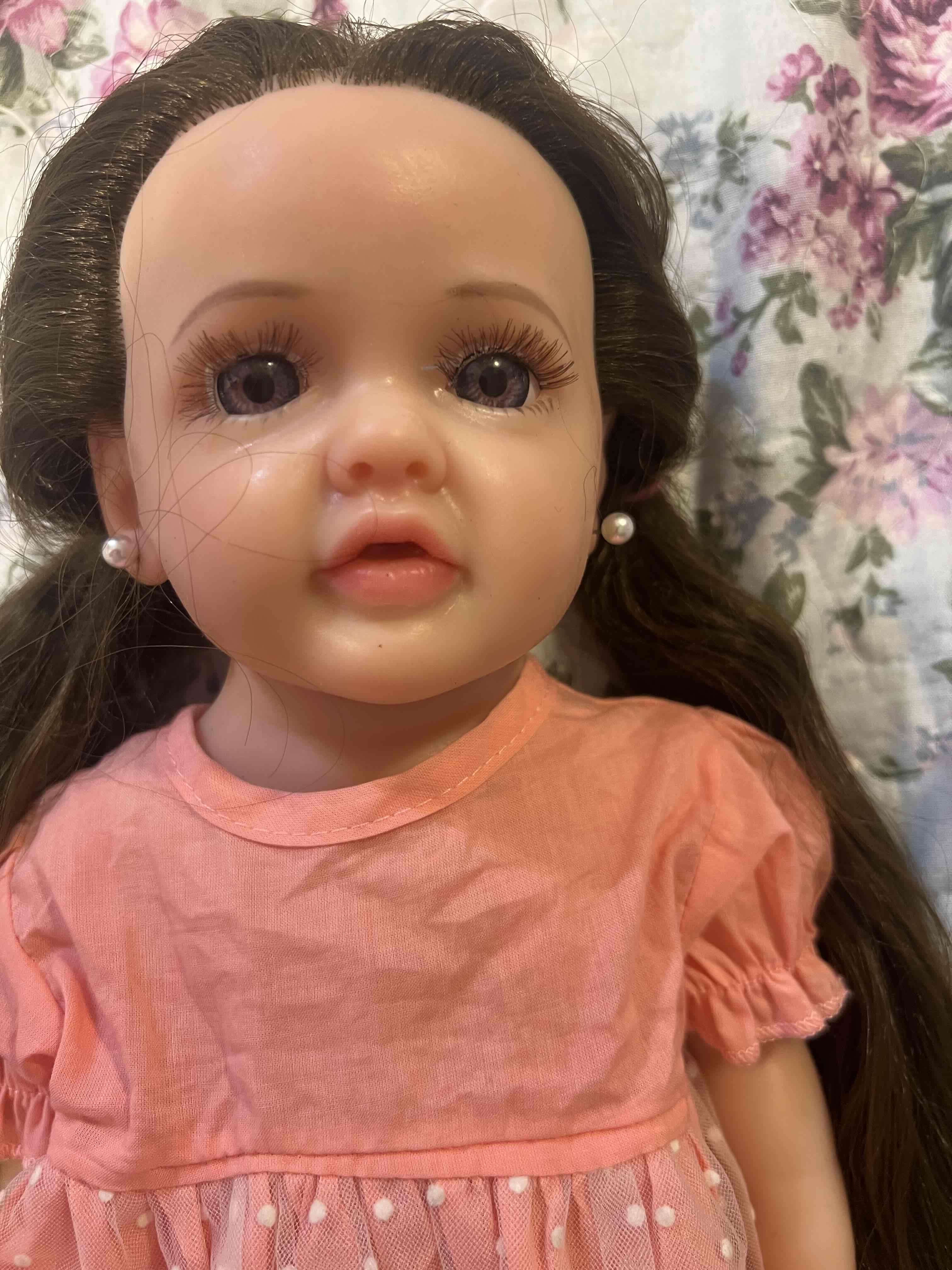 Muñeca con vestido rosado de silicona - 1