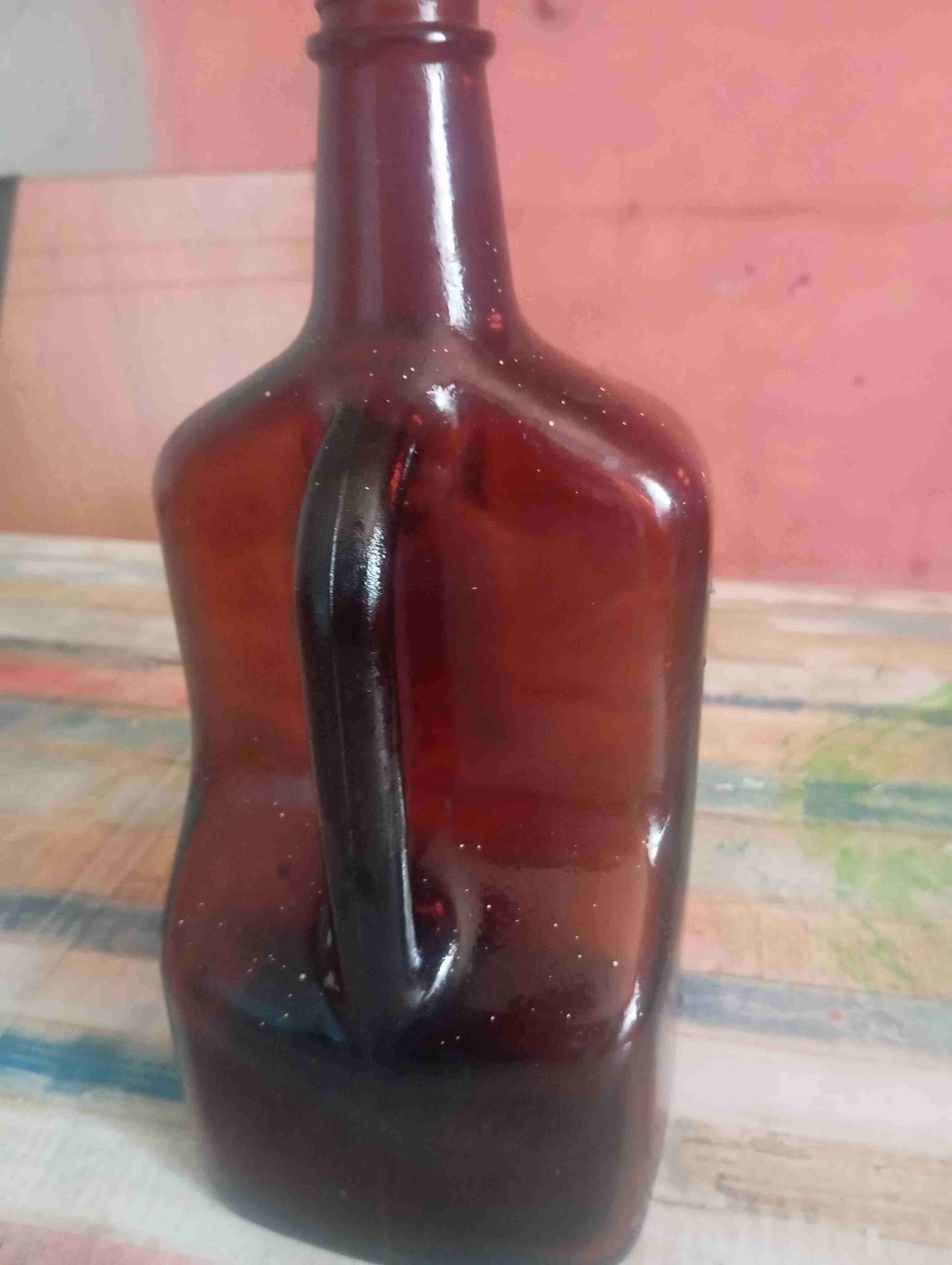 Botella de vidrio ámbar con asa - miniatura 1