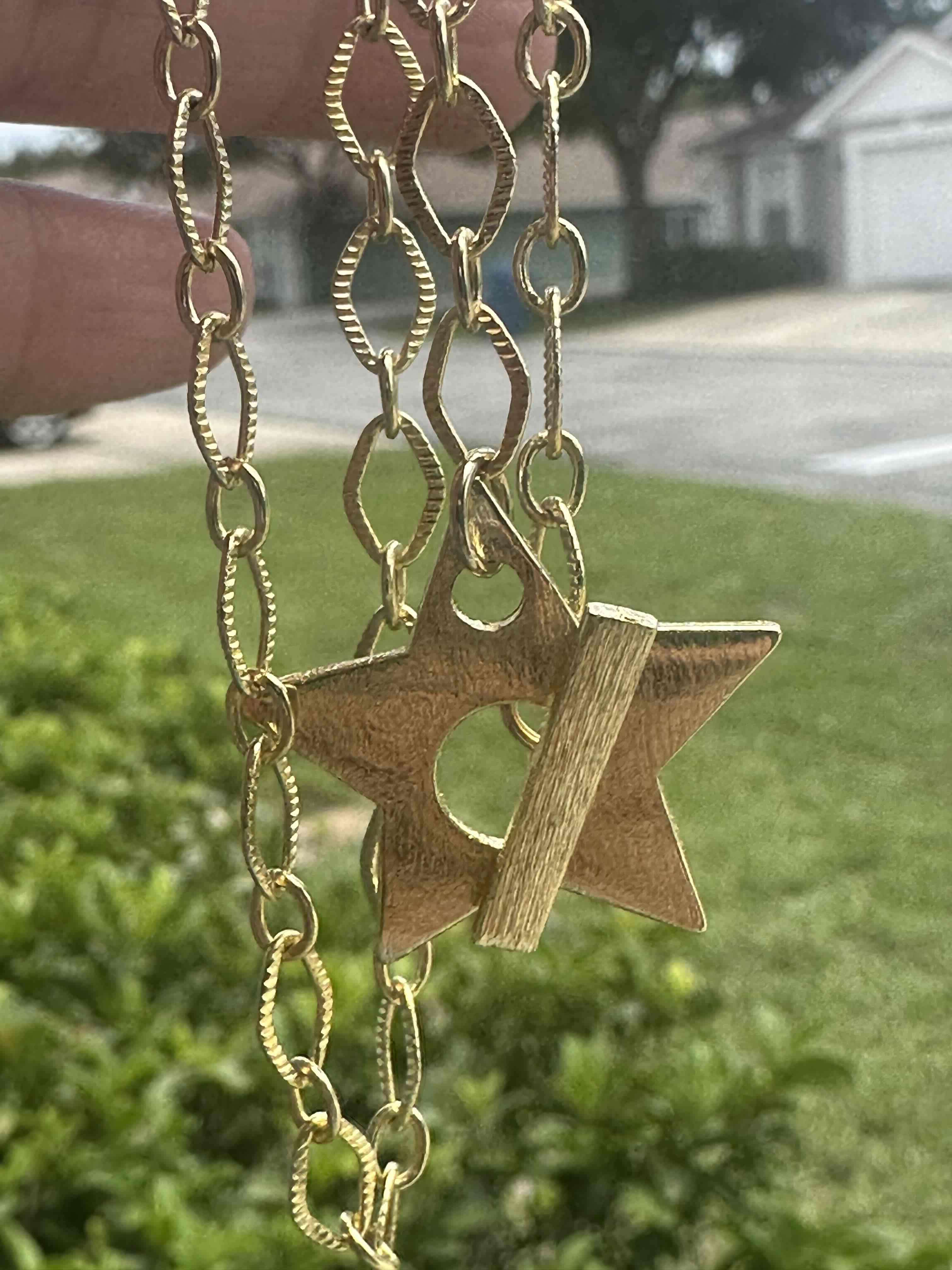 Collar dorado con colgante de estrella - miniatura 4