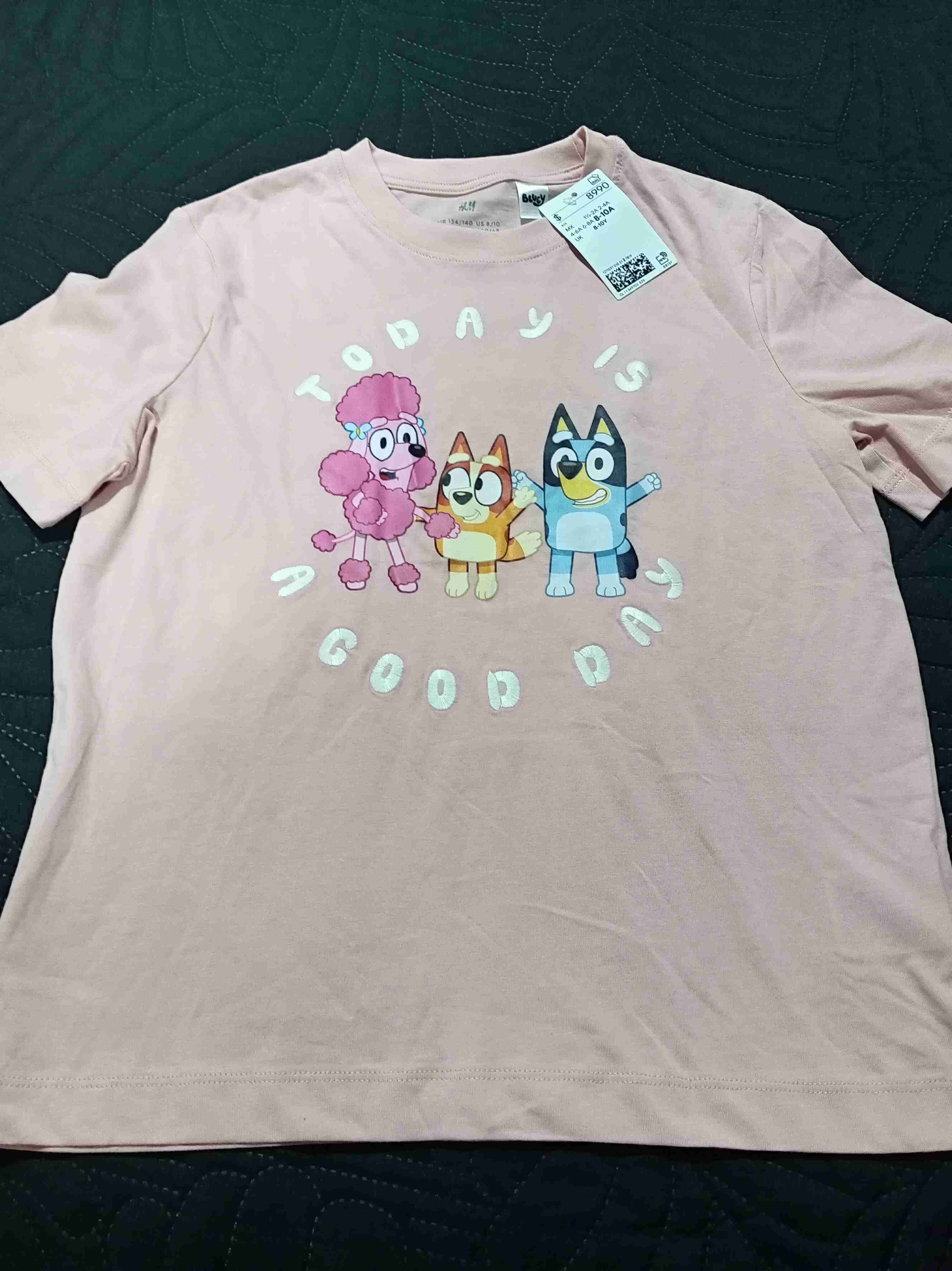 Polera rosada con diseño infantil talla 8 años