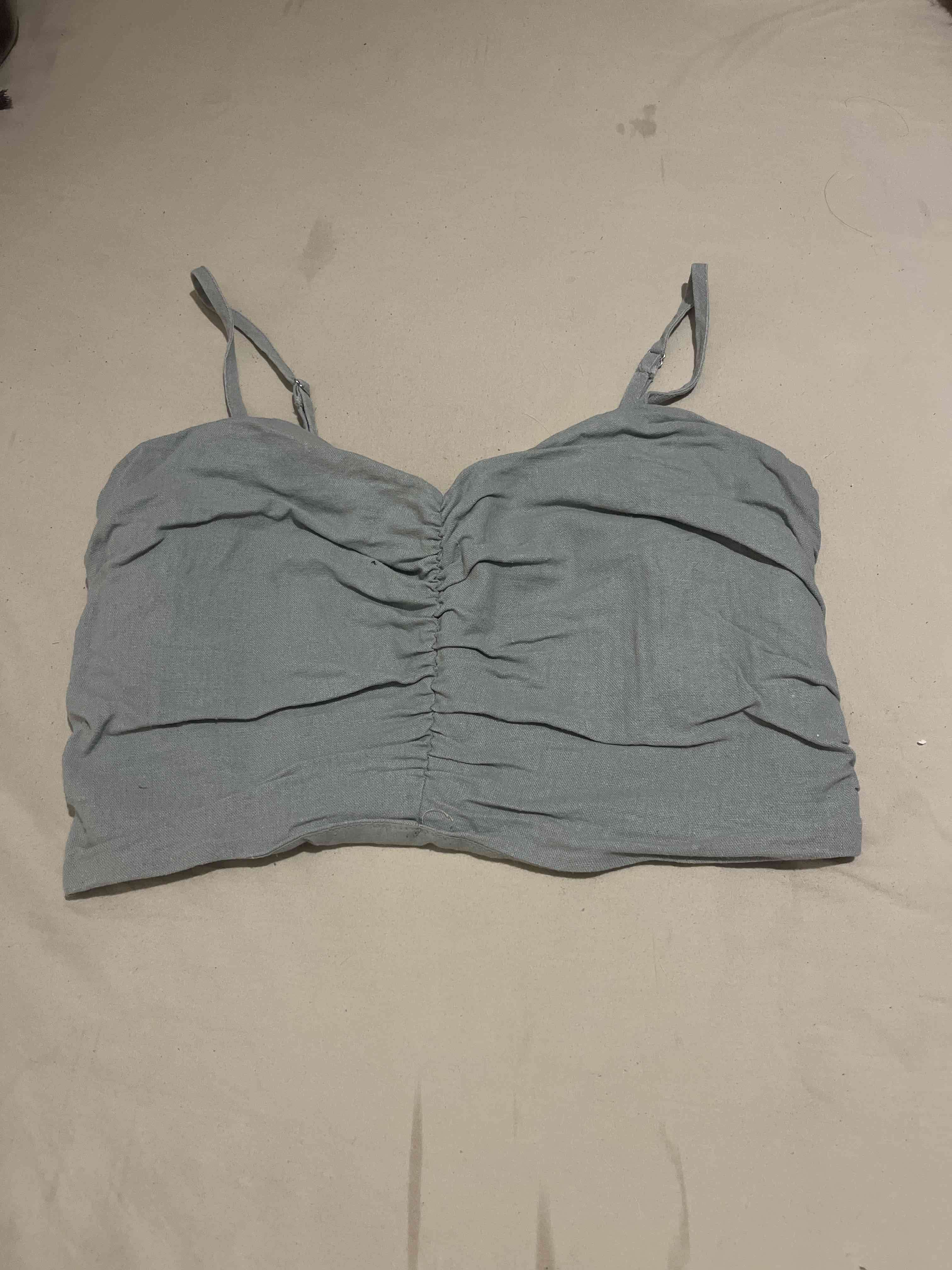 Top celeste  con tirantes ajustables