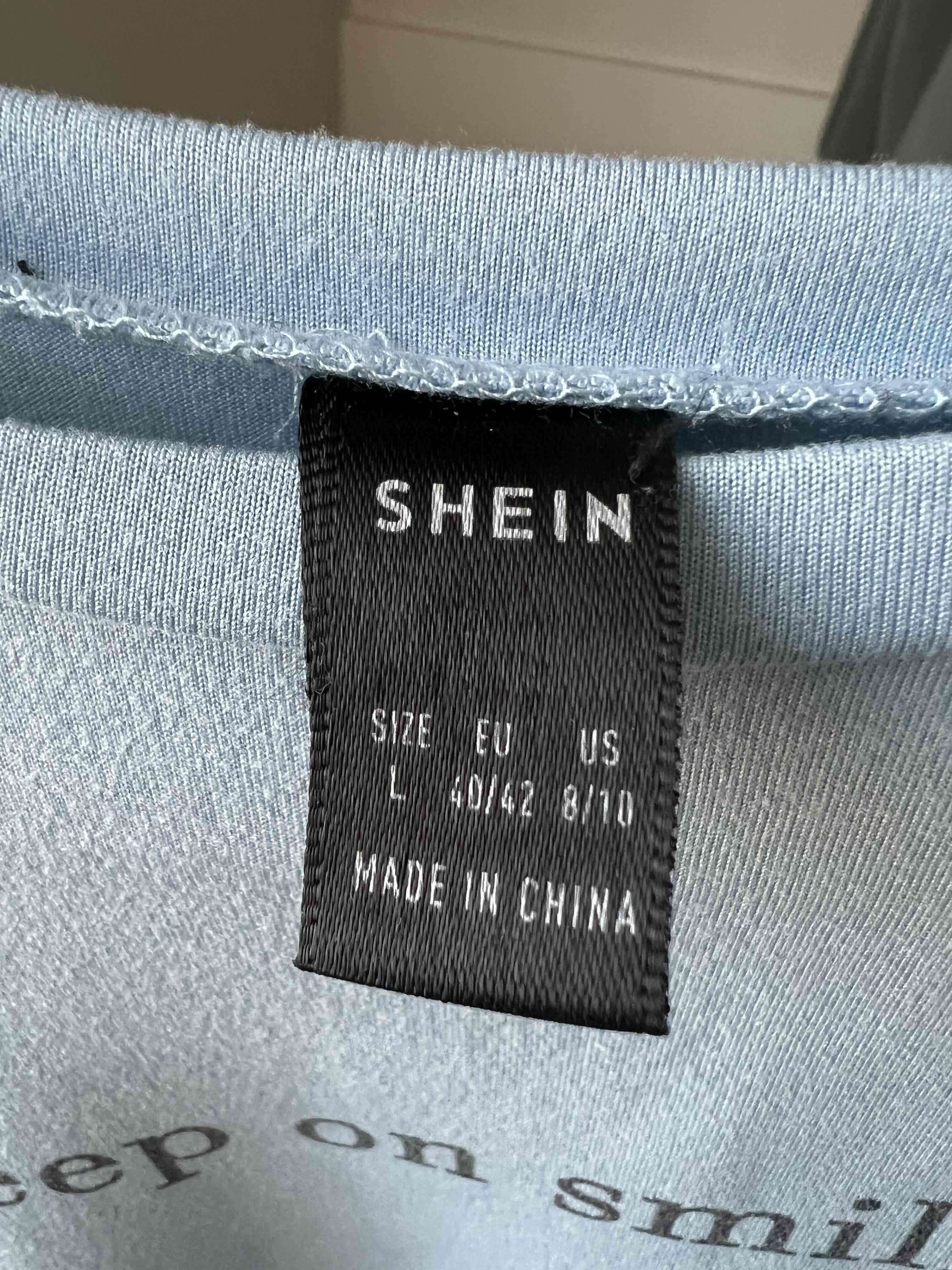 Polera azul con mensaje - miniatura 4