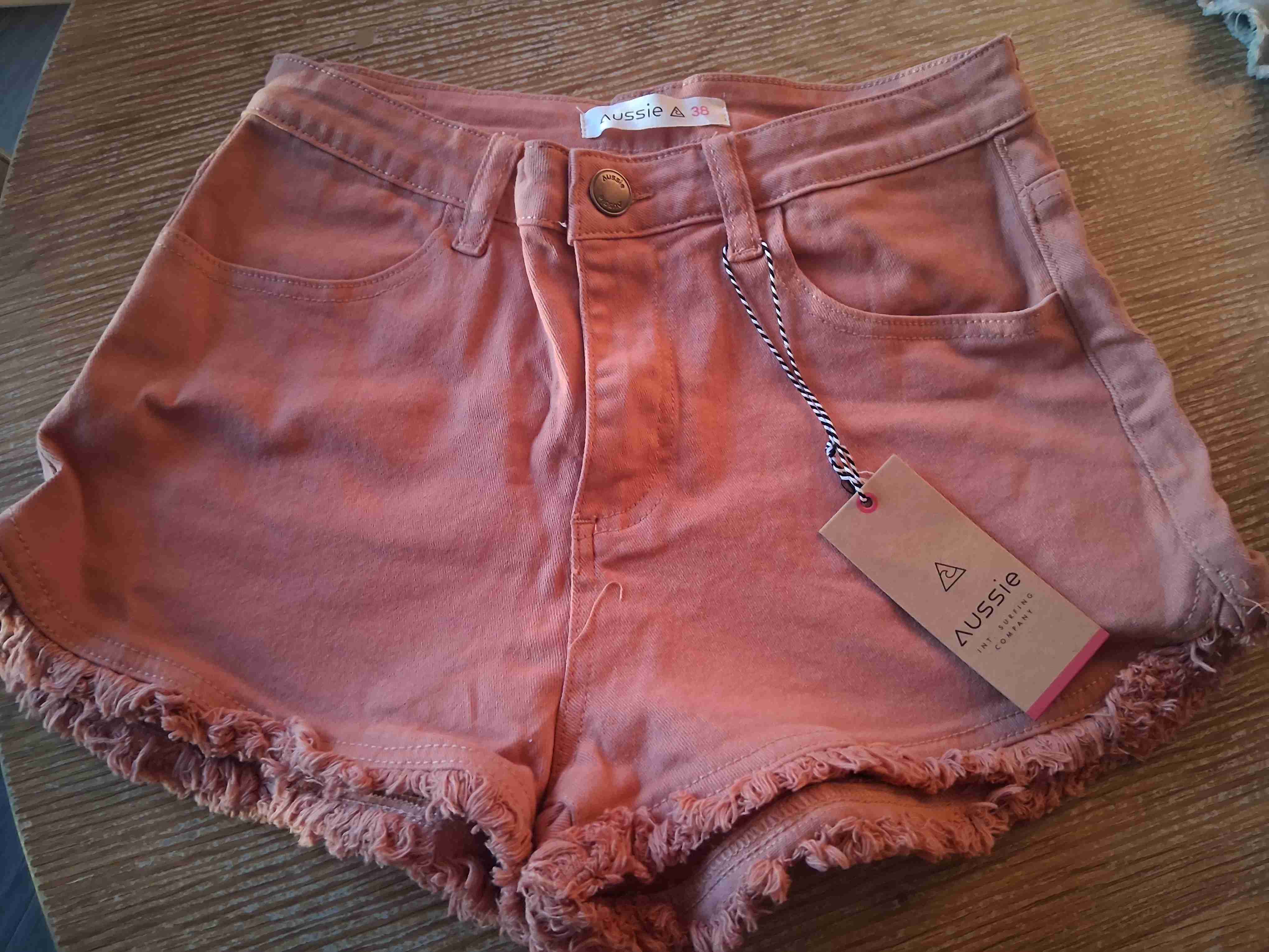 Shorts rosados con flecos