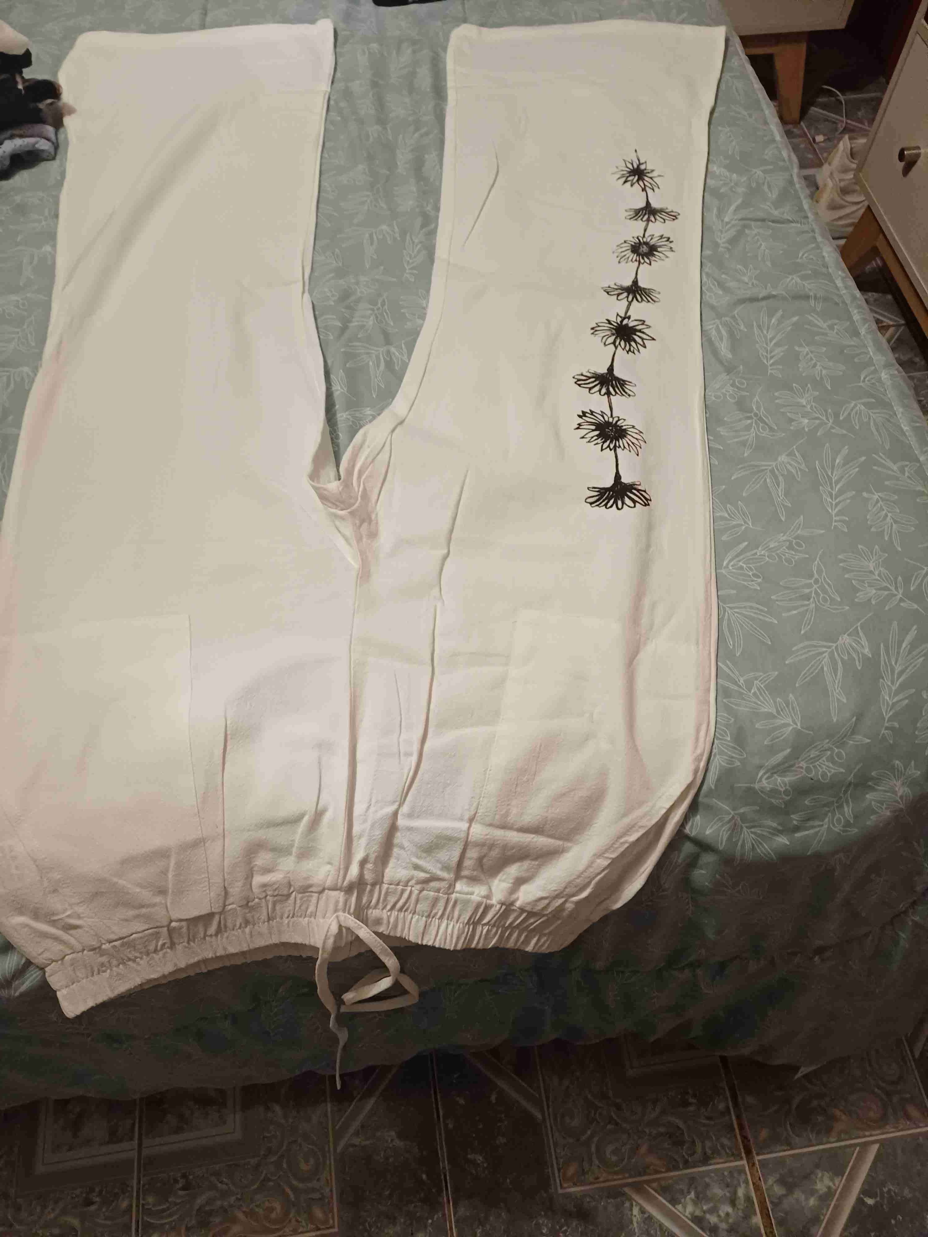 Pantalones blancos con diseño floral - miniatura 1