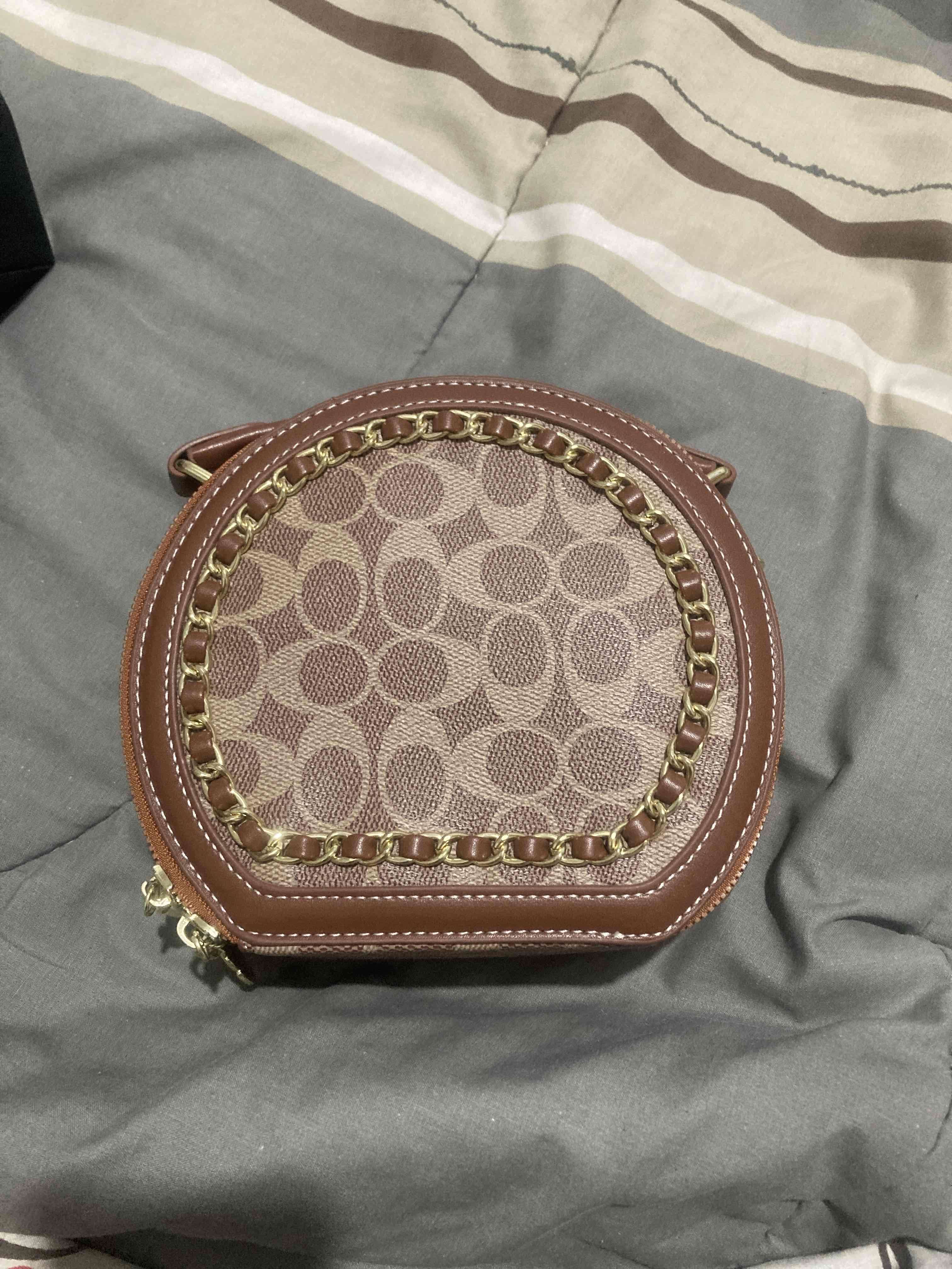 Cartera marrón con diseño estampado - 1