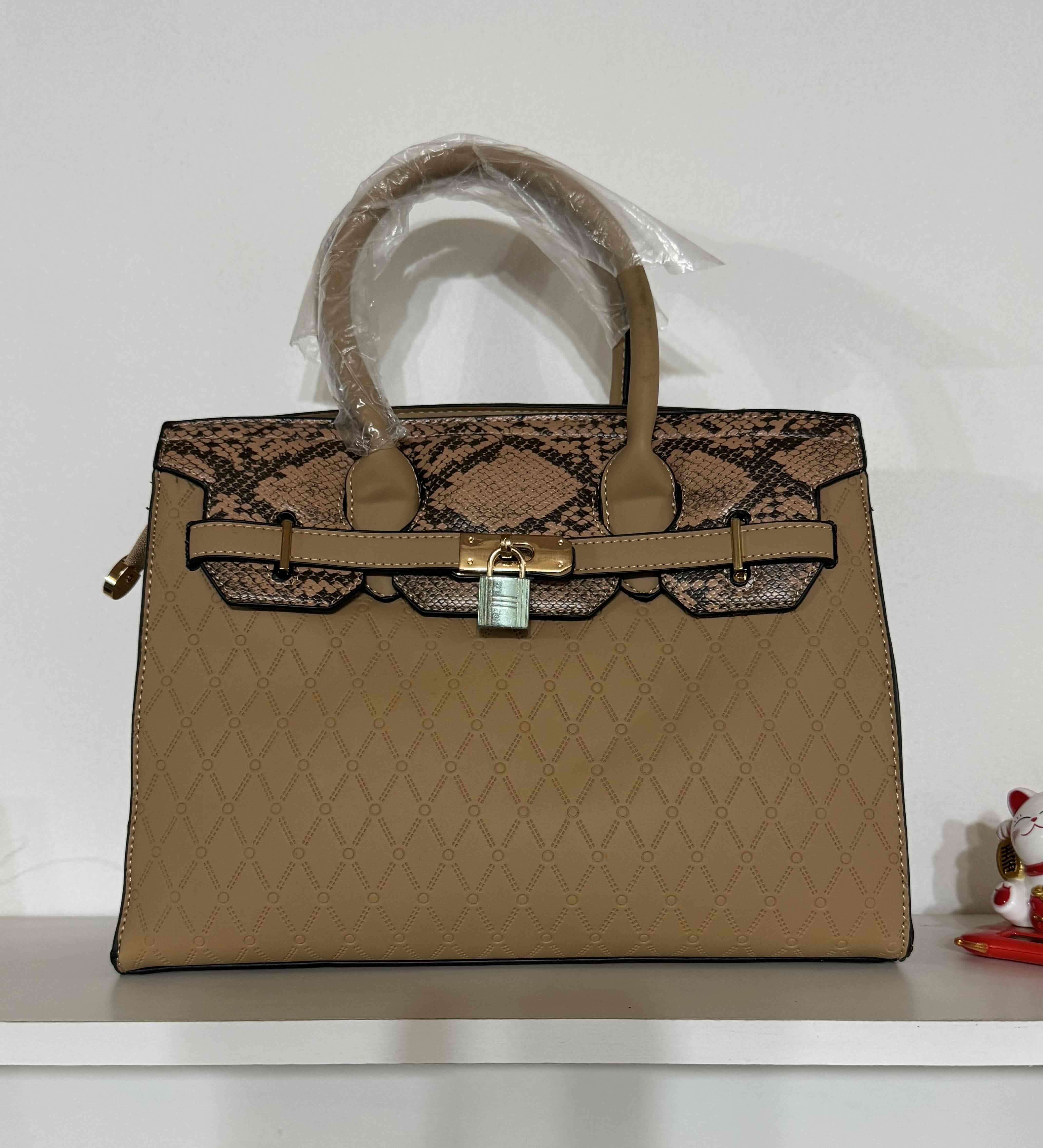 Cartera beige con diseño serpiente - miniatura 1