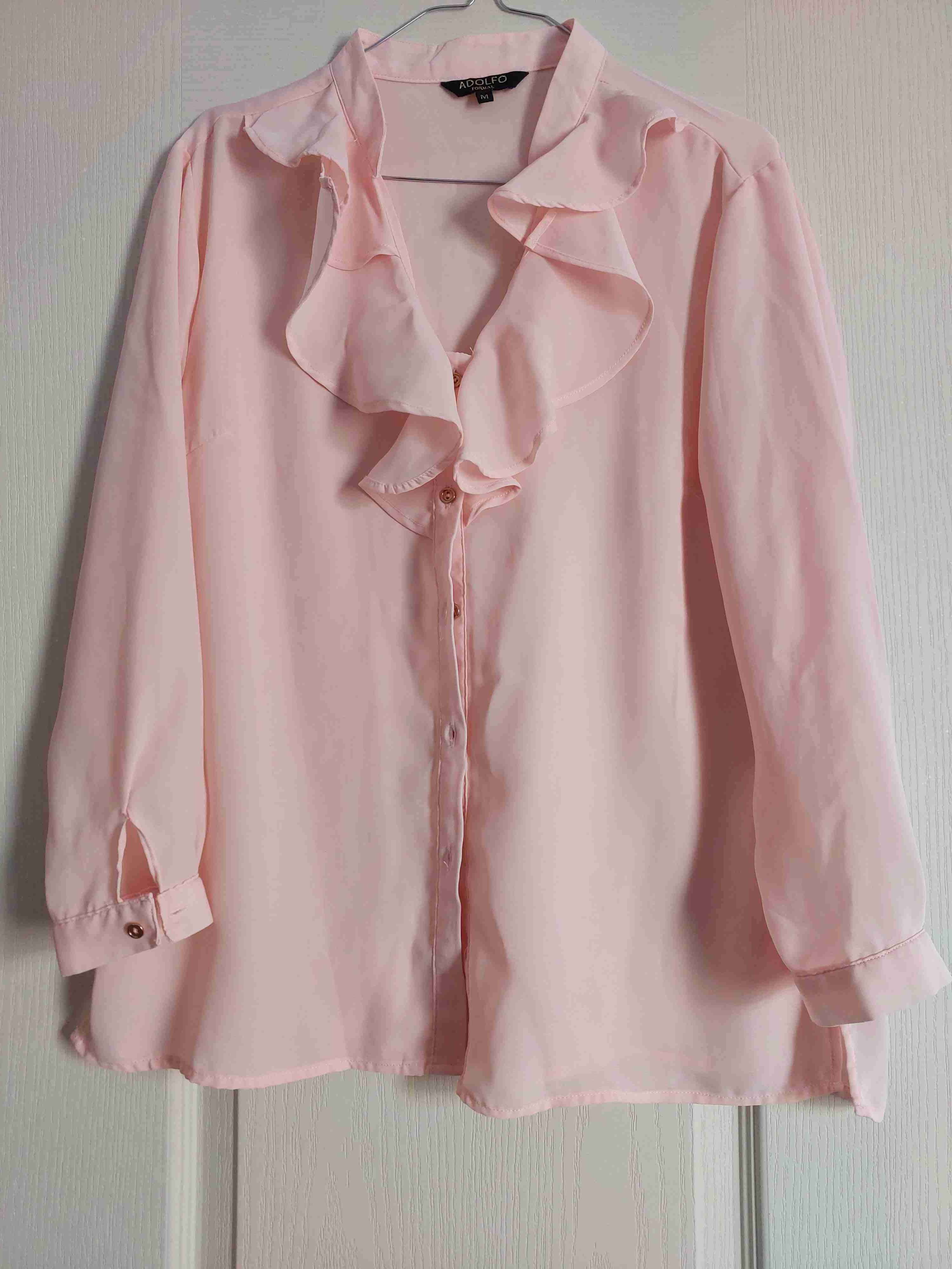 Blusa rosada con volantes talla M