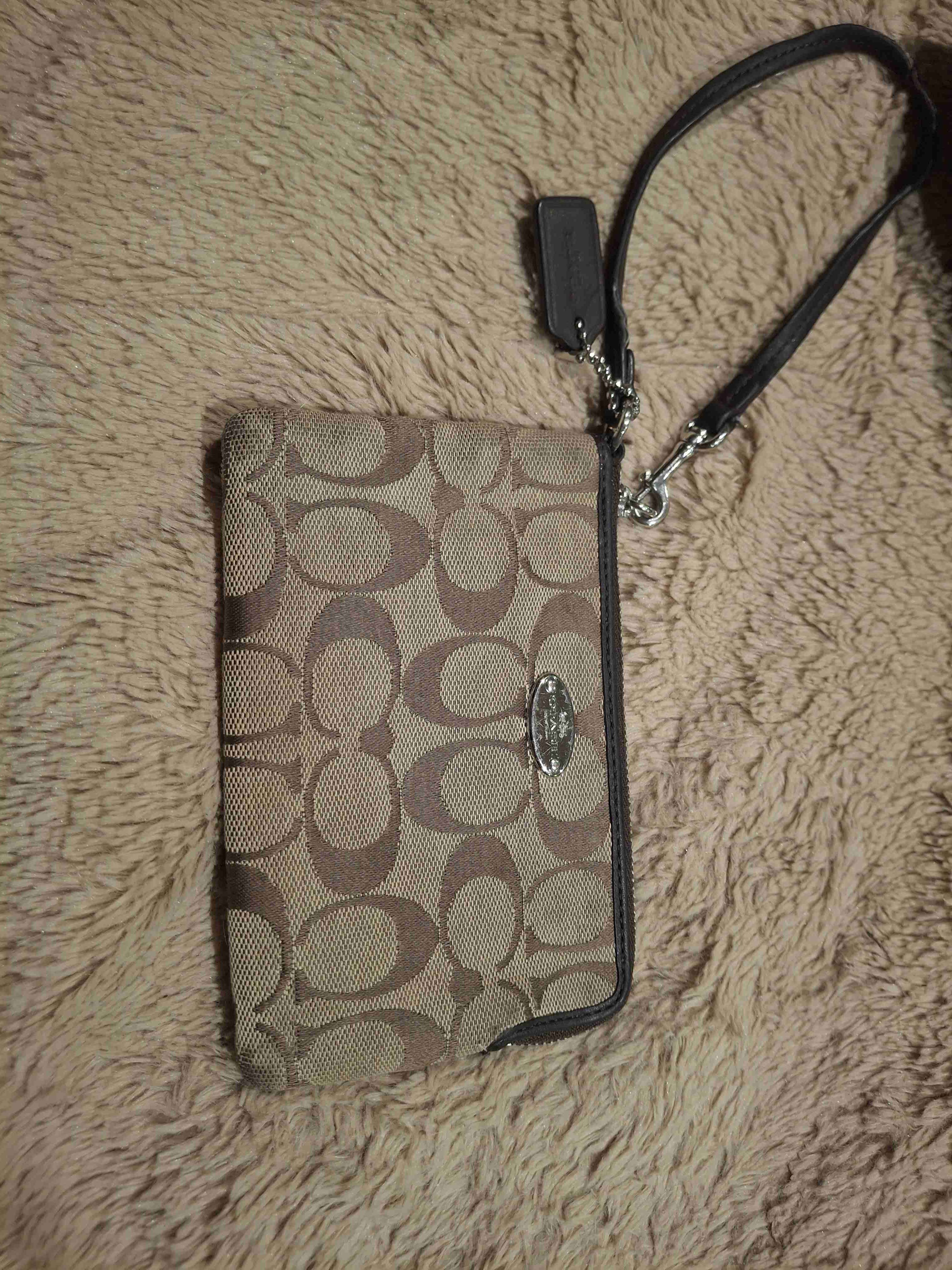 Cartera de mano coach