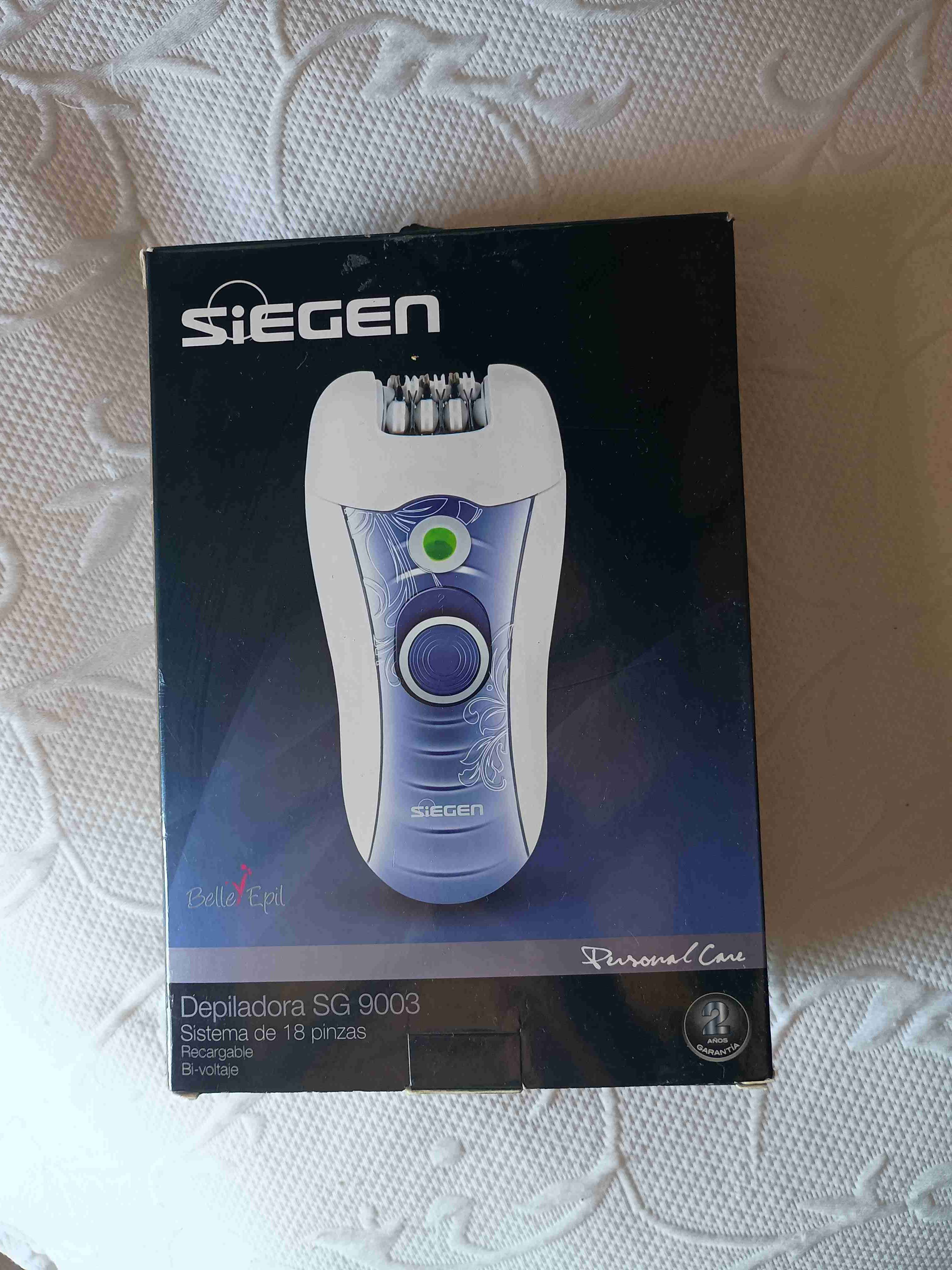 Depiladora eléctrica blanca y morada - miniatura 4