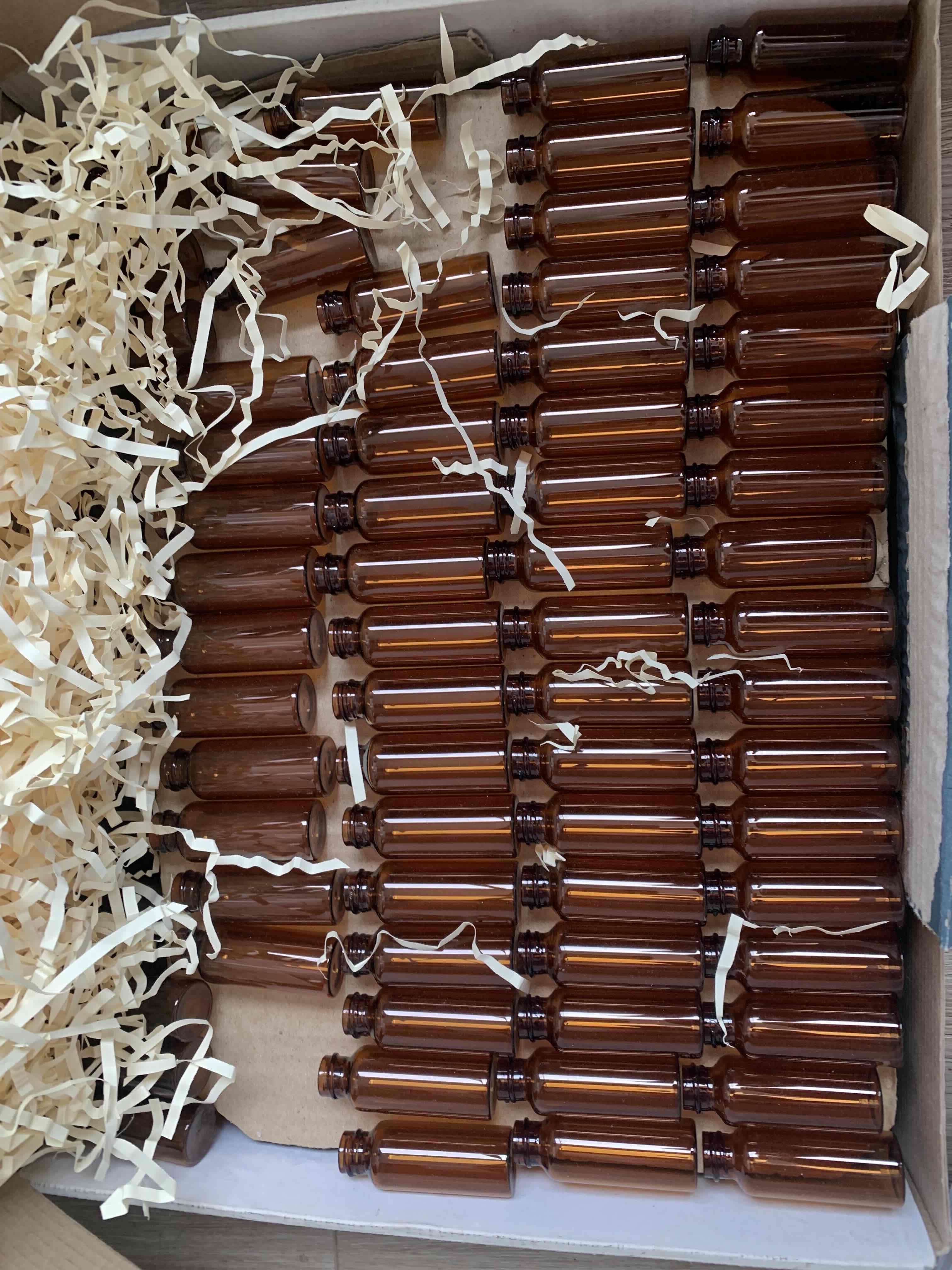 Botellas de vidrio ámbar y blanco - miniatura 1