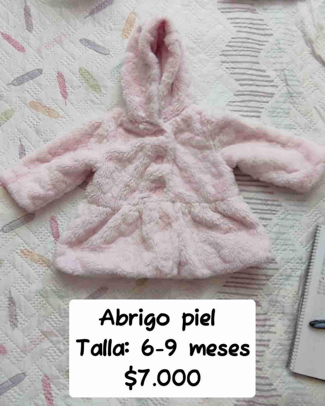 Abrigo de piel rosado bebé