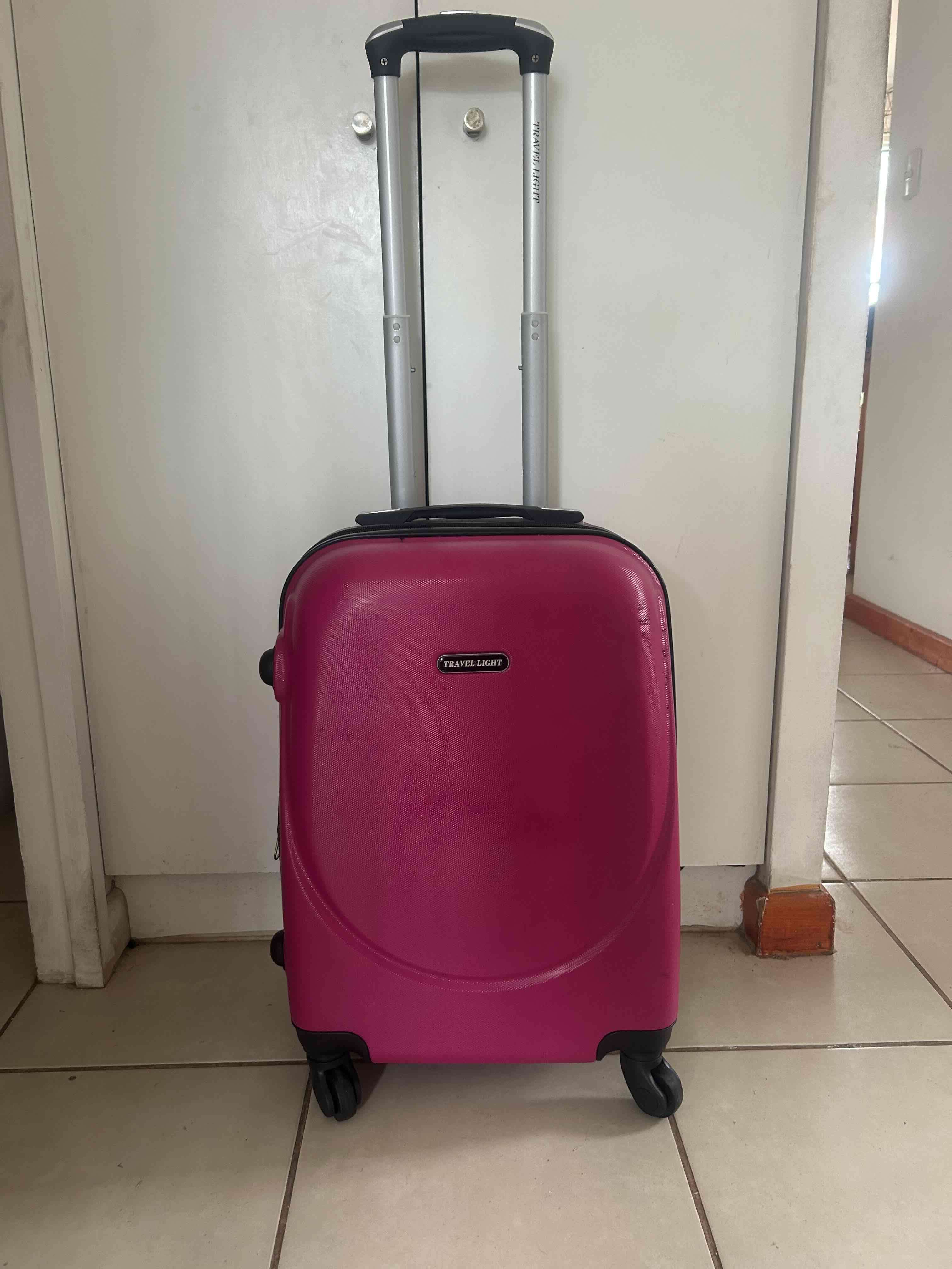 Maleta fucsia con ruedas - miniatura 1