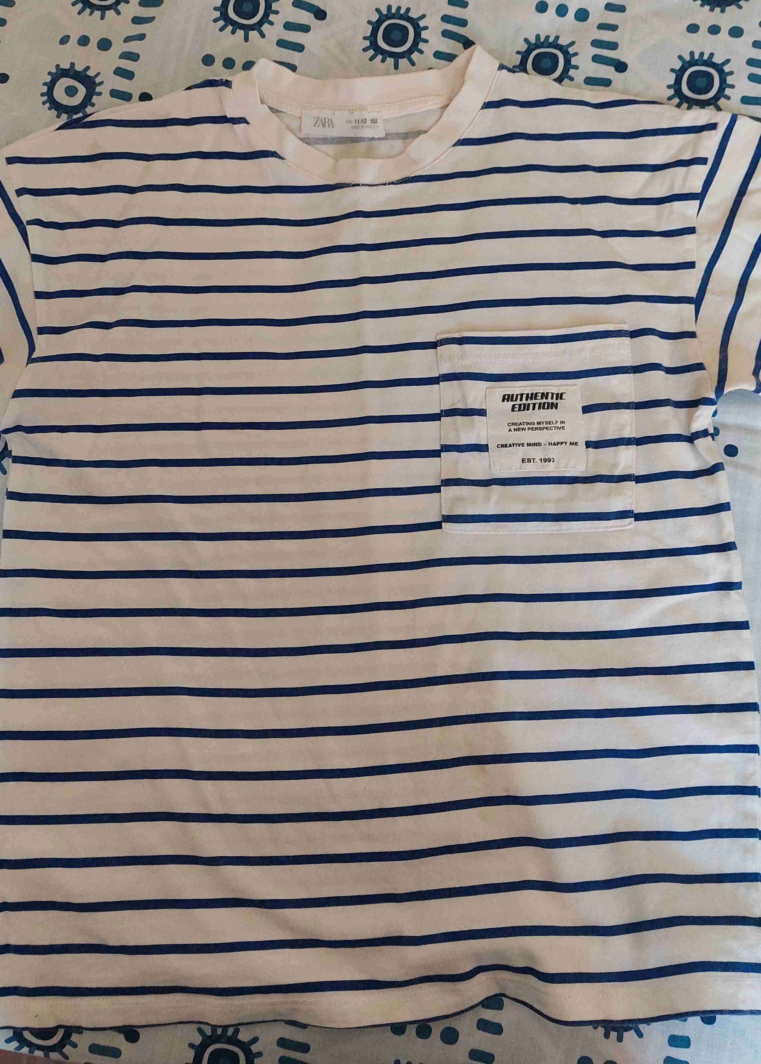 Polera rayada blanca y azul