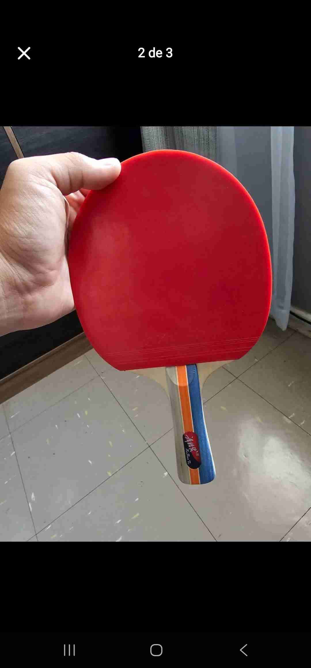 Raqueta de ping pong roja