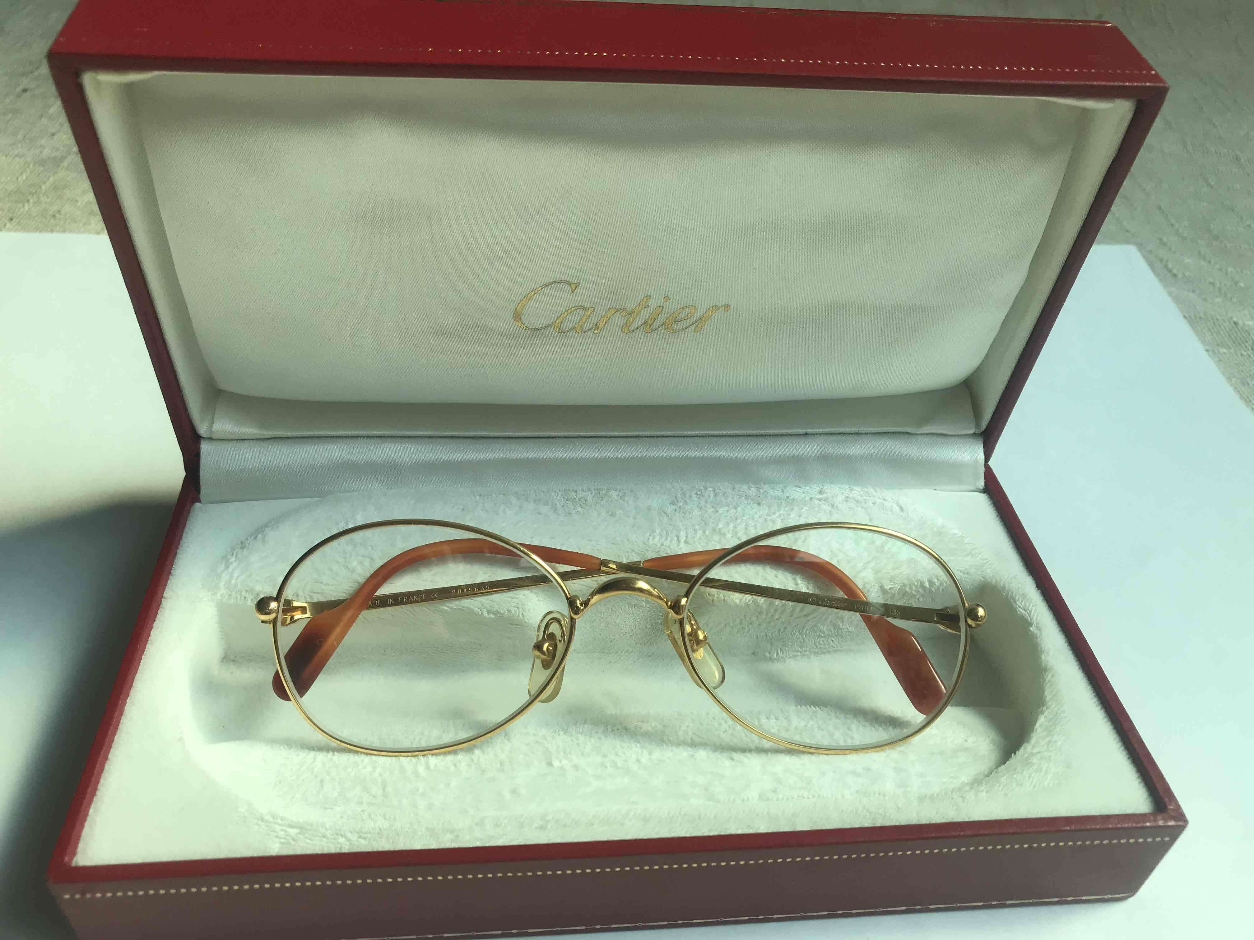 Lentes Cartier dorados en estuche - miniatura 1