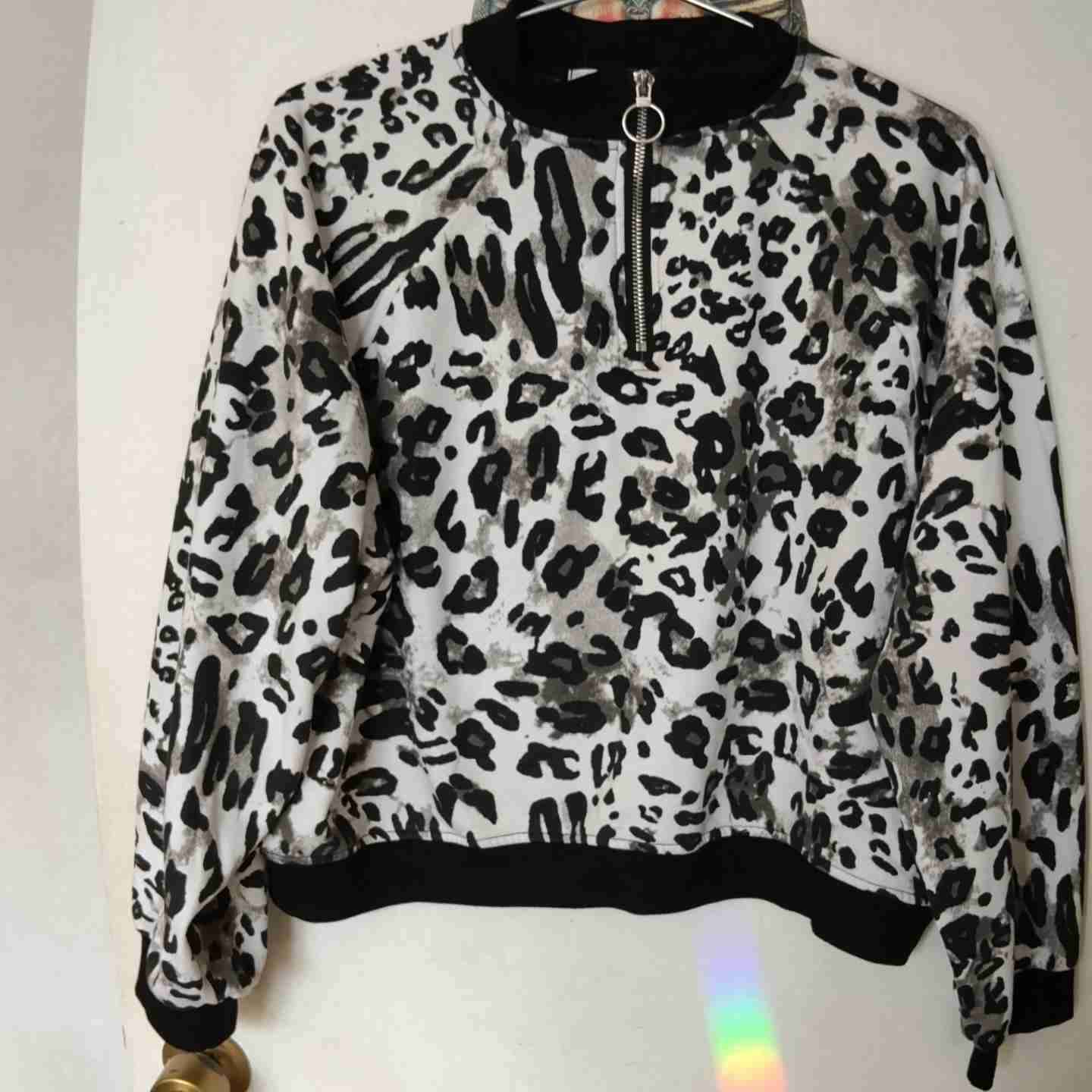 Buzo estampado animal print - miniatura 1