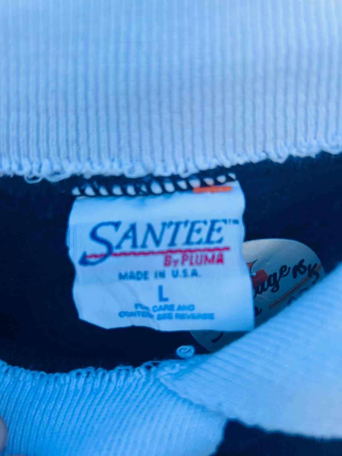 Suéter azul con diseño bordado - miniatura 2