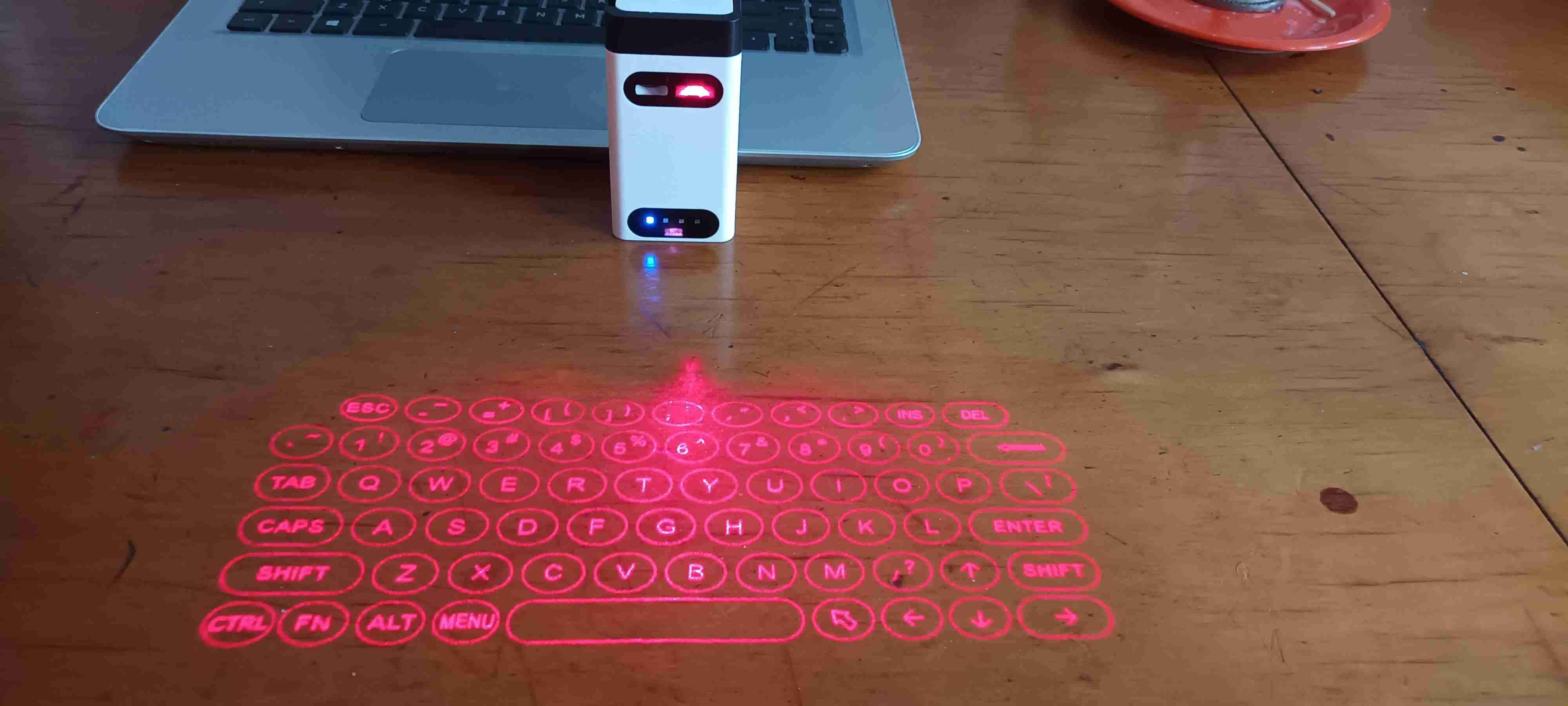 Teclado láser portátil con conexion bluetooth - miniatura 1