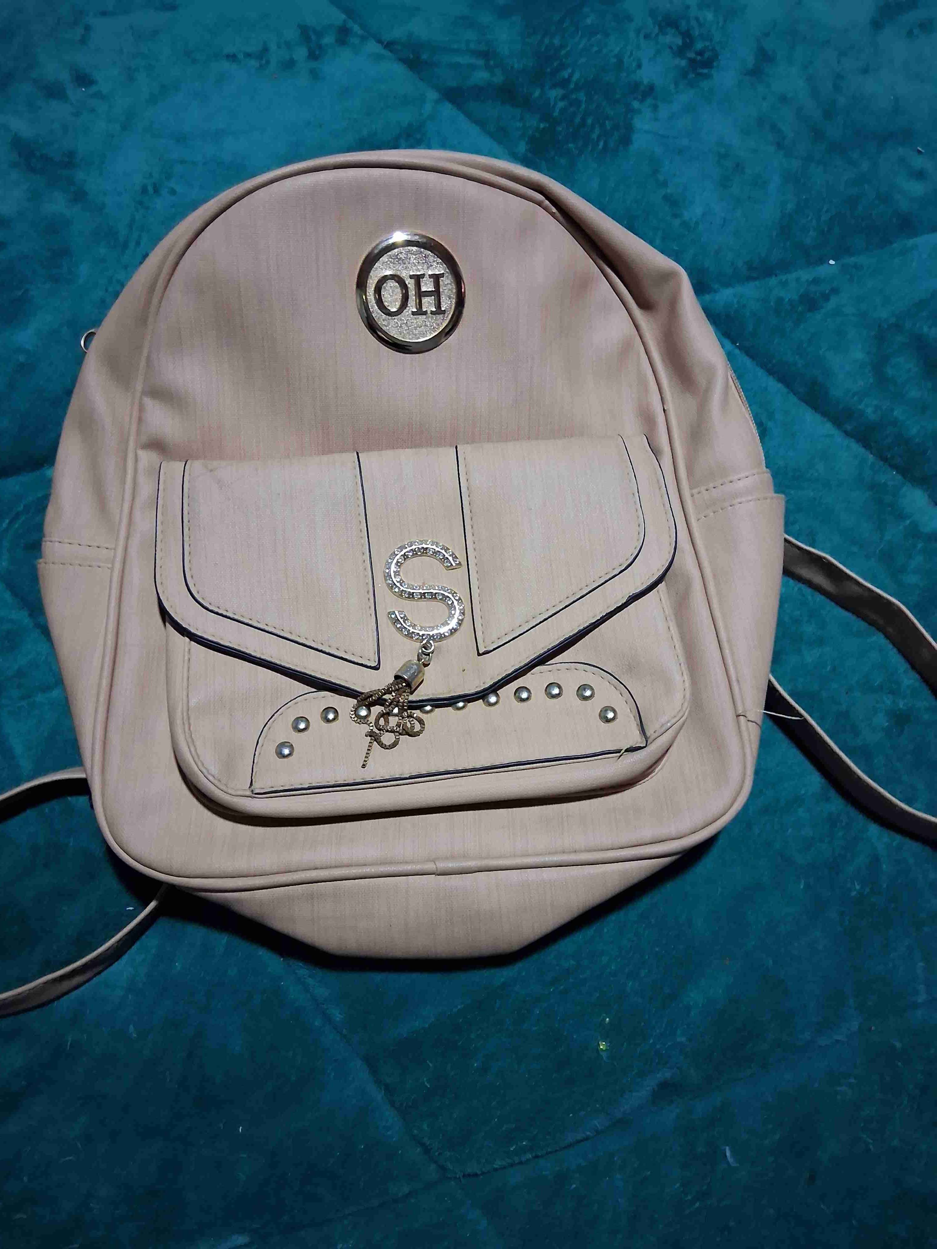 Mochila beige con diseño S