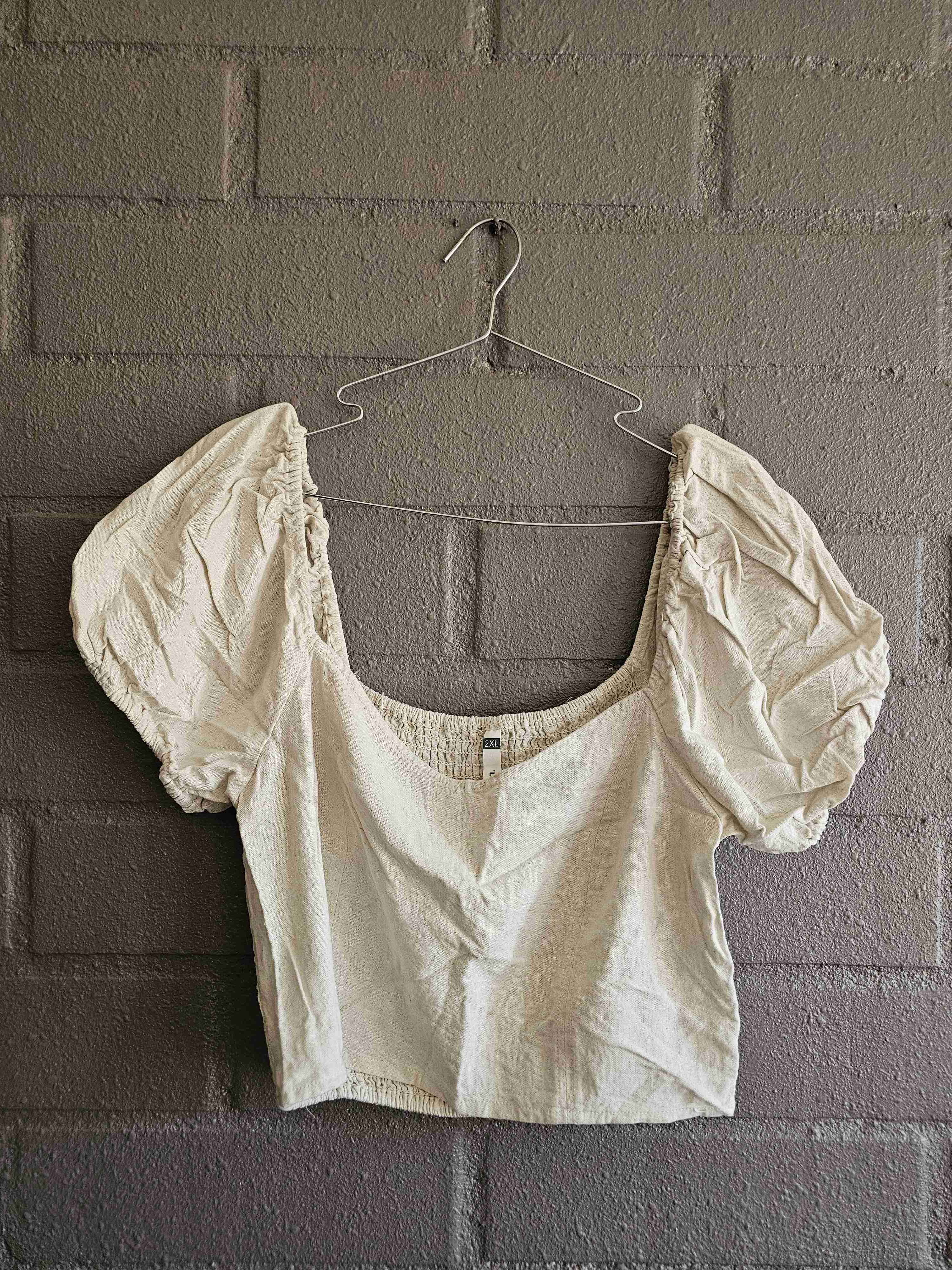 Blusa con mangas abullonadas