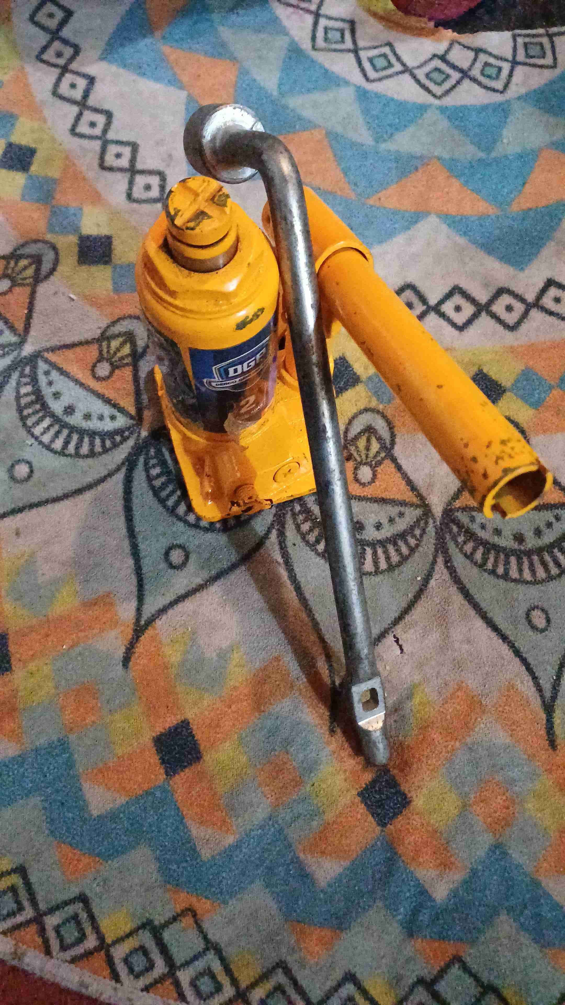 Gato hidráulico de botella amarillo