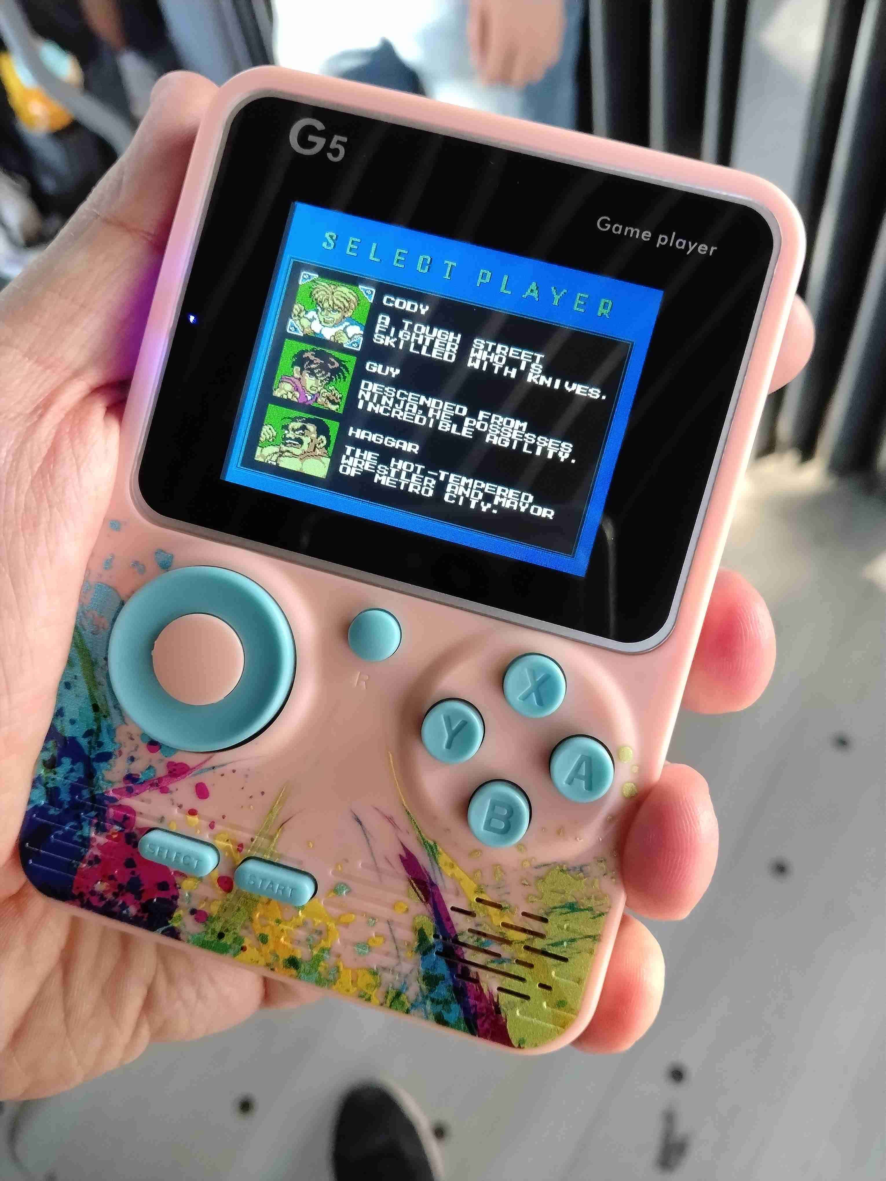 Consola de juegos portátil G5 rosada juegos de nes - miniatura 3