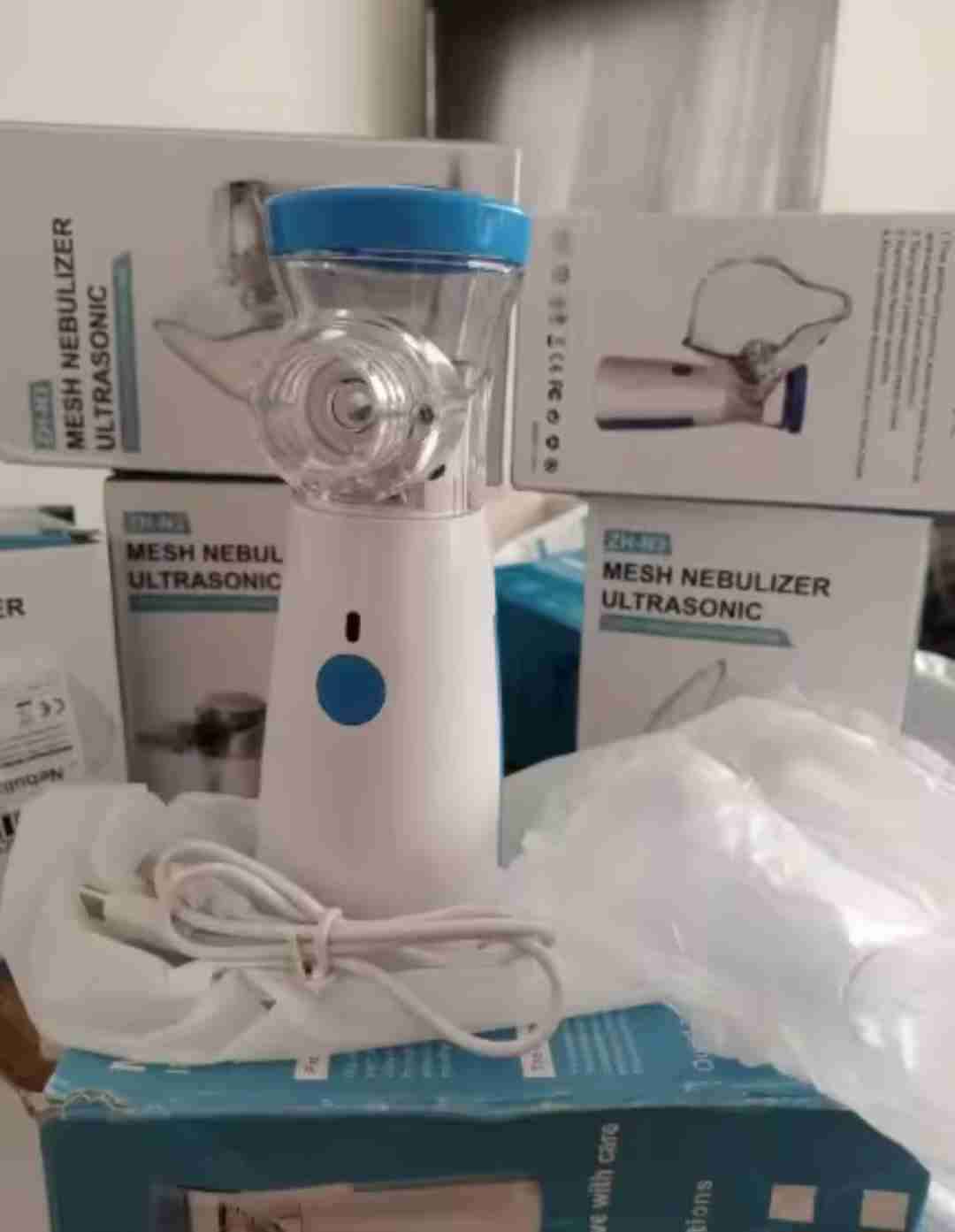 Nebulizador portátil azul ,blanco y rosado - miniatura 3