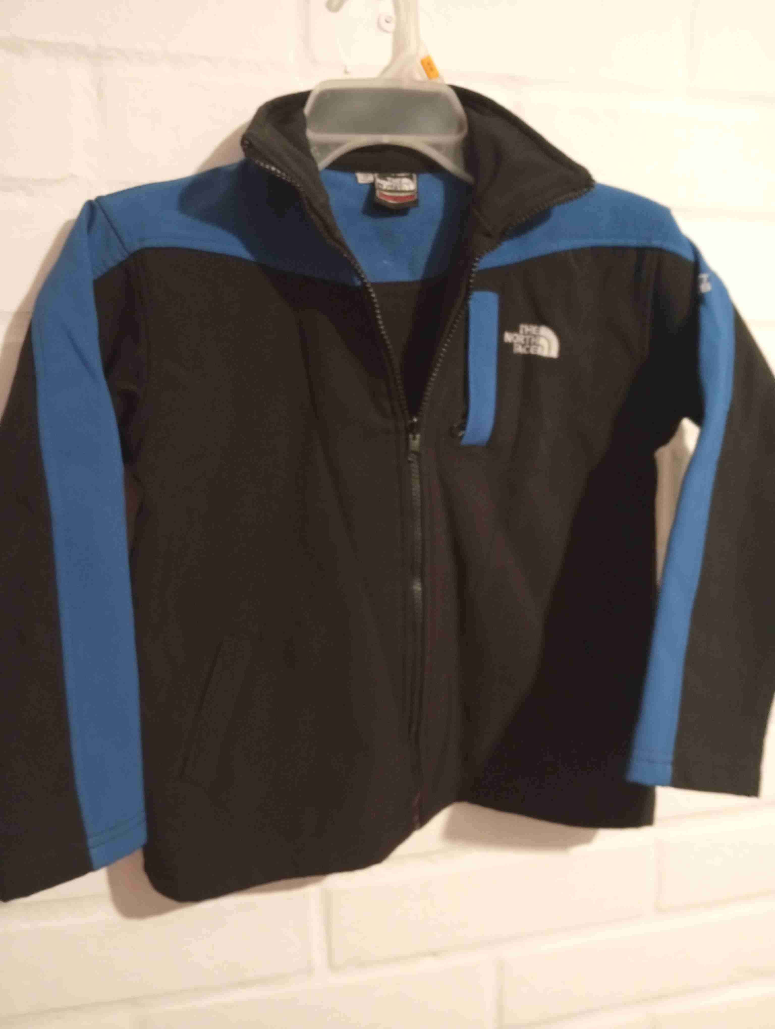 Chaqueta polar negra y azul North Face - miniatura 1